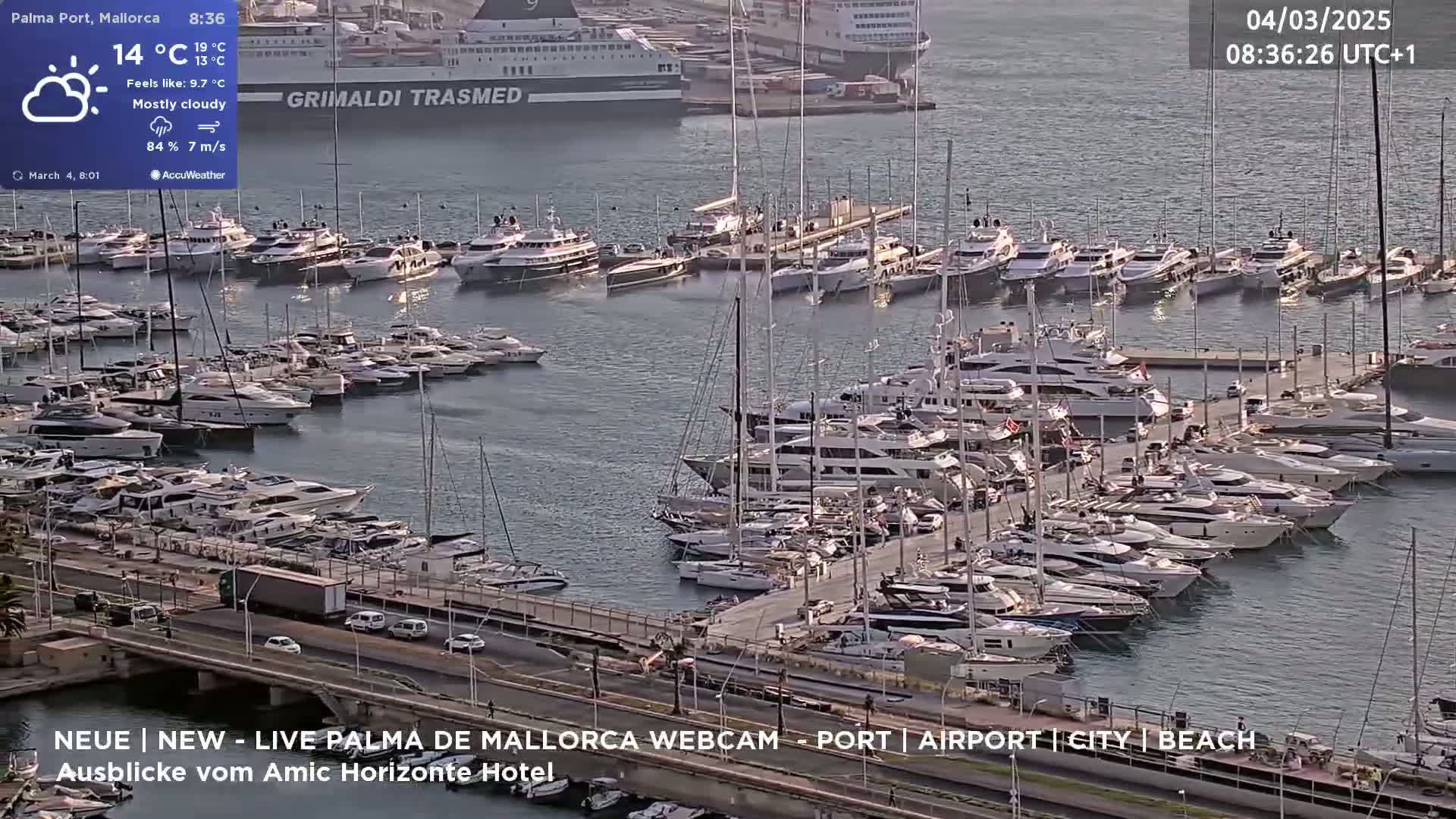 A mostly cloudy harbor filled with numerous yachts and boats under a partly sunny sky.