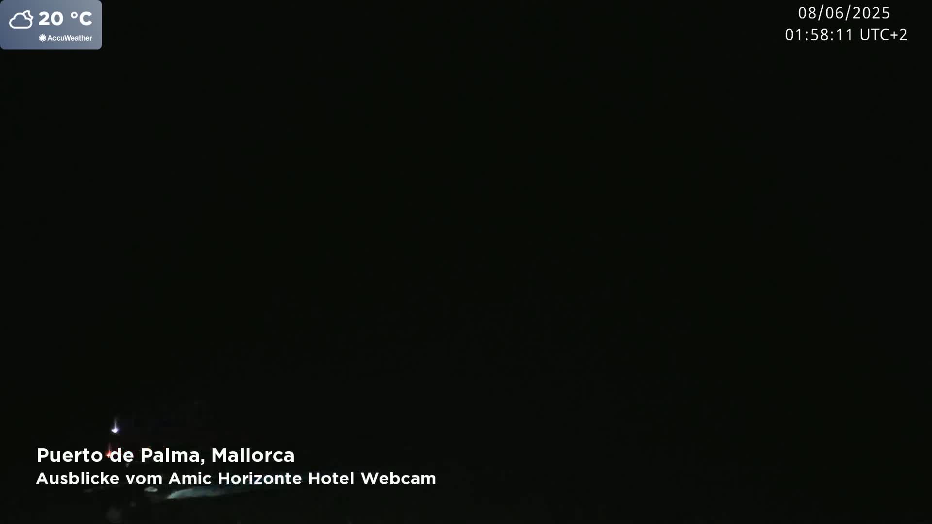 A mostly dark nighttime scene at 20°C with a few faint lights visible.