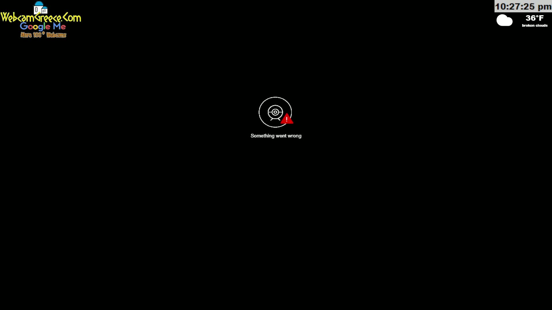 A black screen displays a white webcam icon with a red exclamation mark and the message "Something went wrong," under a time and temperature display showing 36°F and broken clouds.