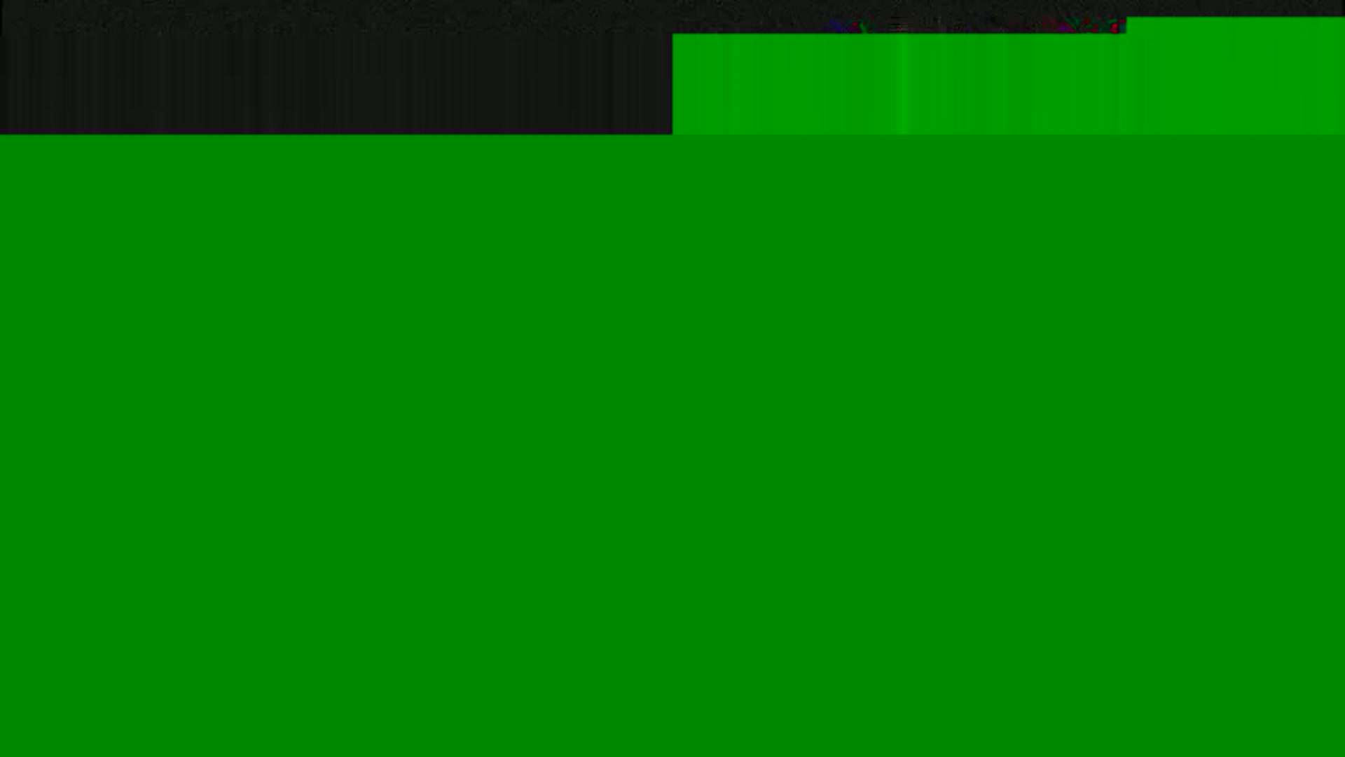 The image shows a mostly solid green field with a small black band at the top.