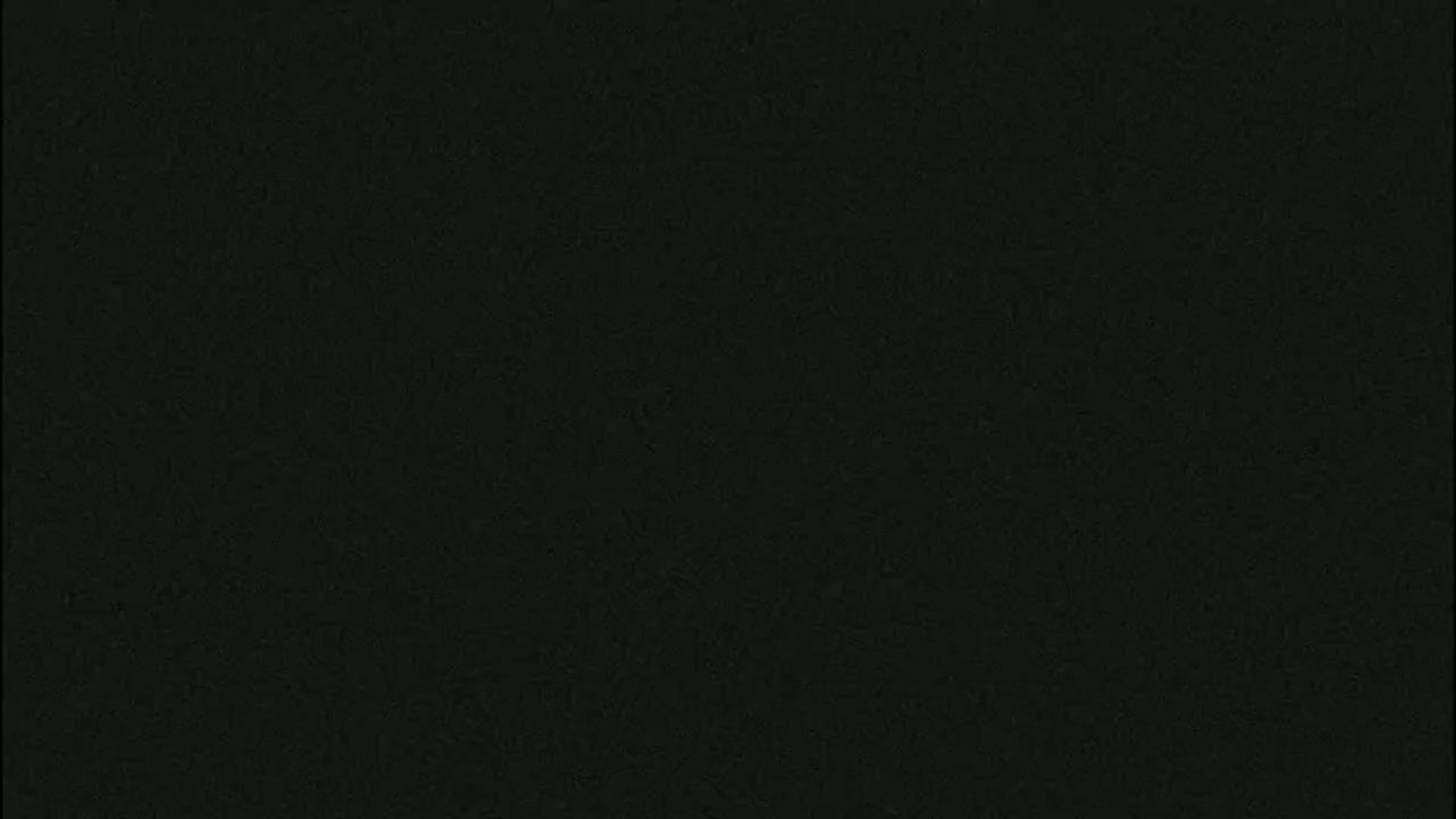 The image is a solid dark-grey/black textured background.