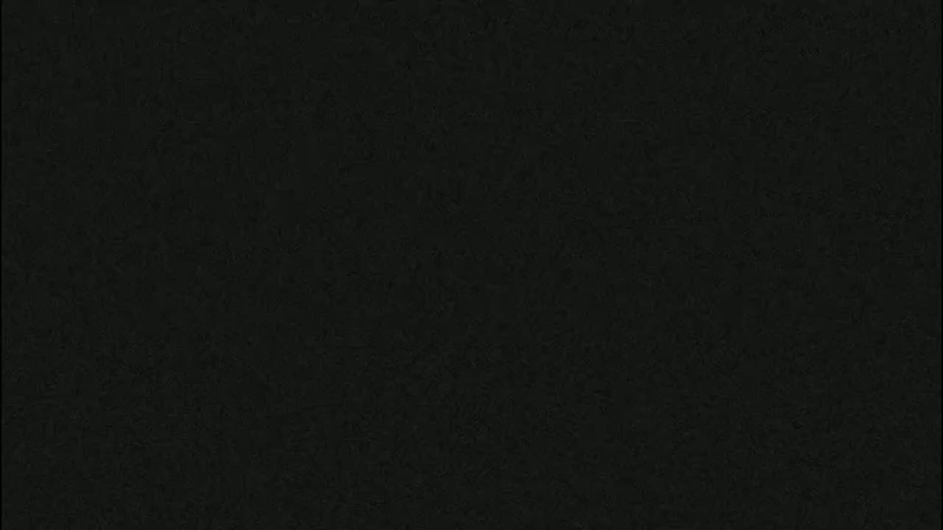 The image is a solid dark-grey/black textured background.