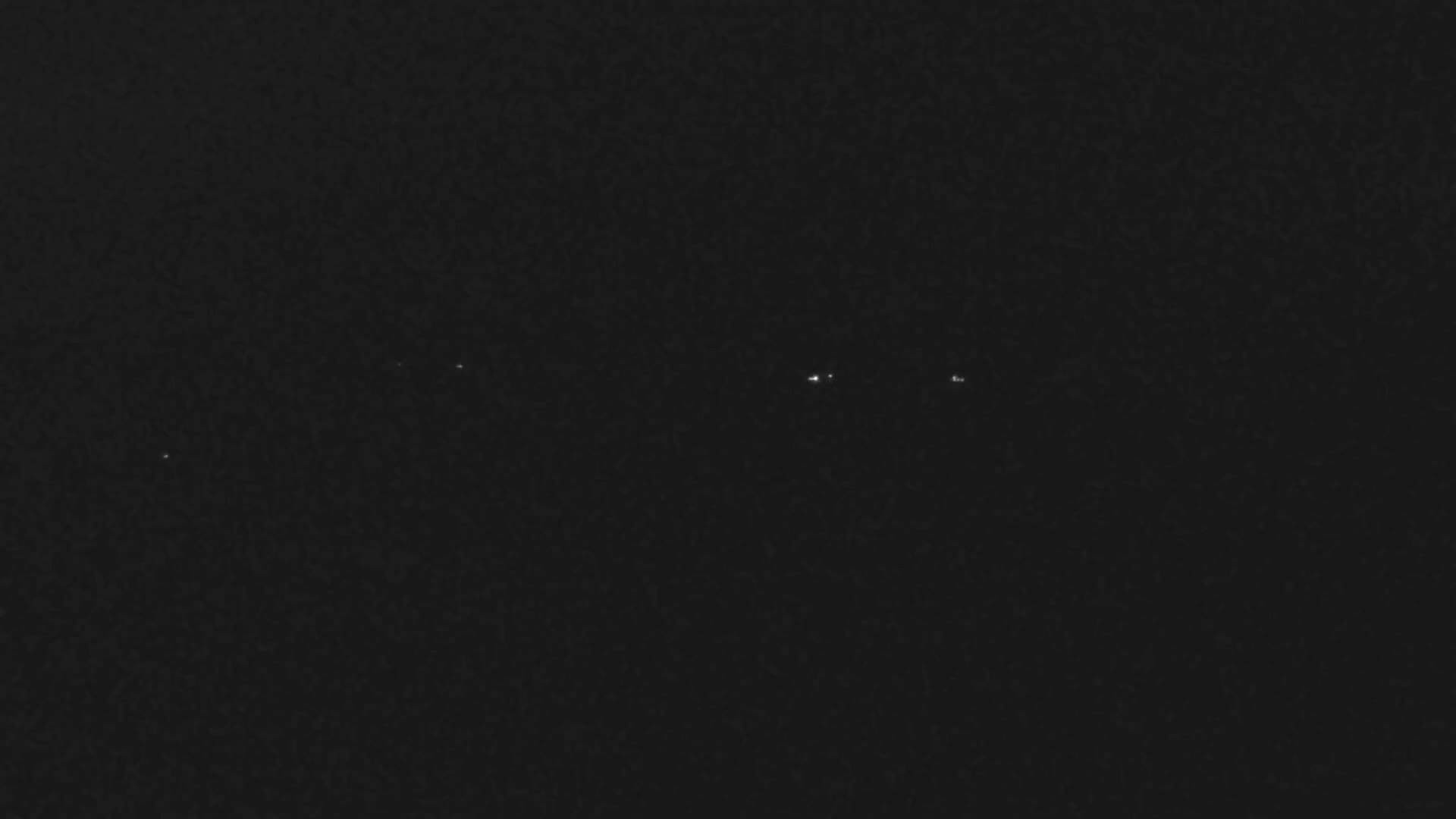 A solid black image displays a subtle, uniform dark grey texture across its entirety.