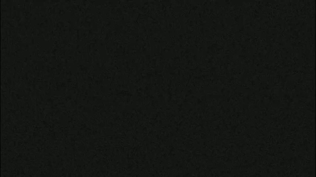 The image shows a dark gray or black textured surface.
