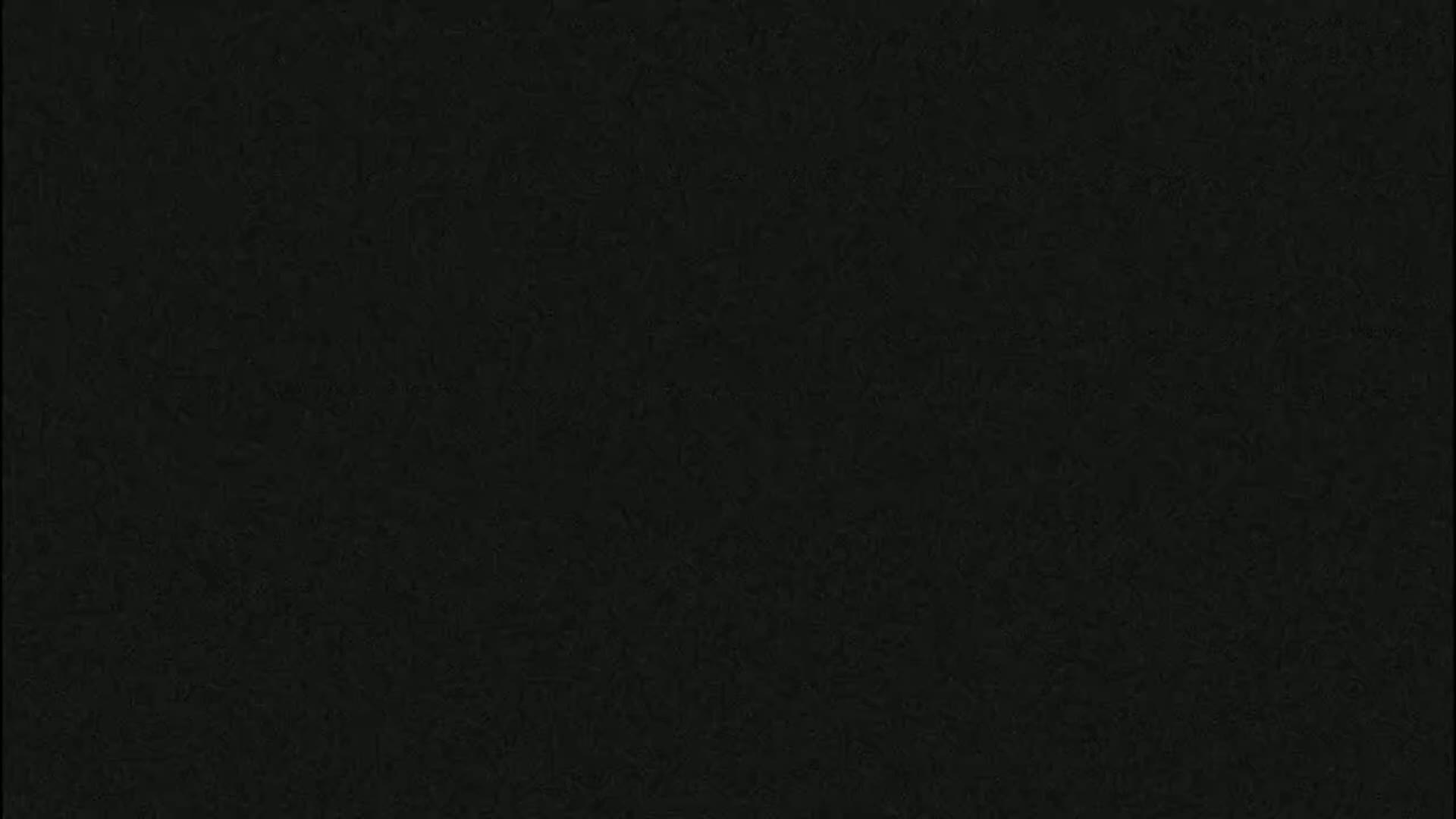 The image is a solid dark-grey or black textured background.