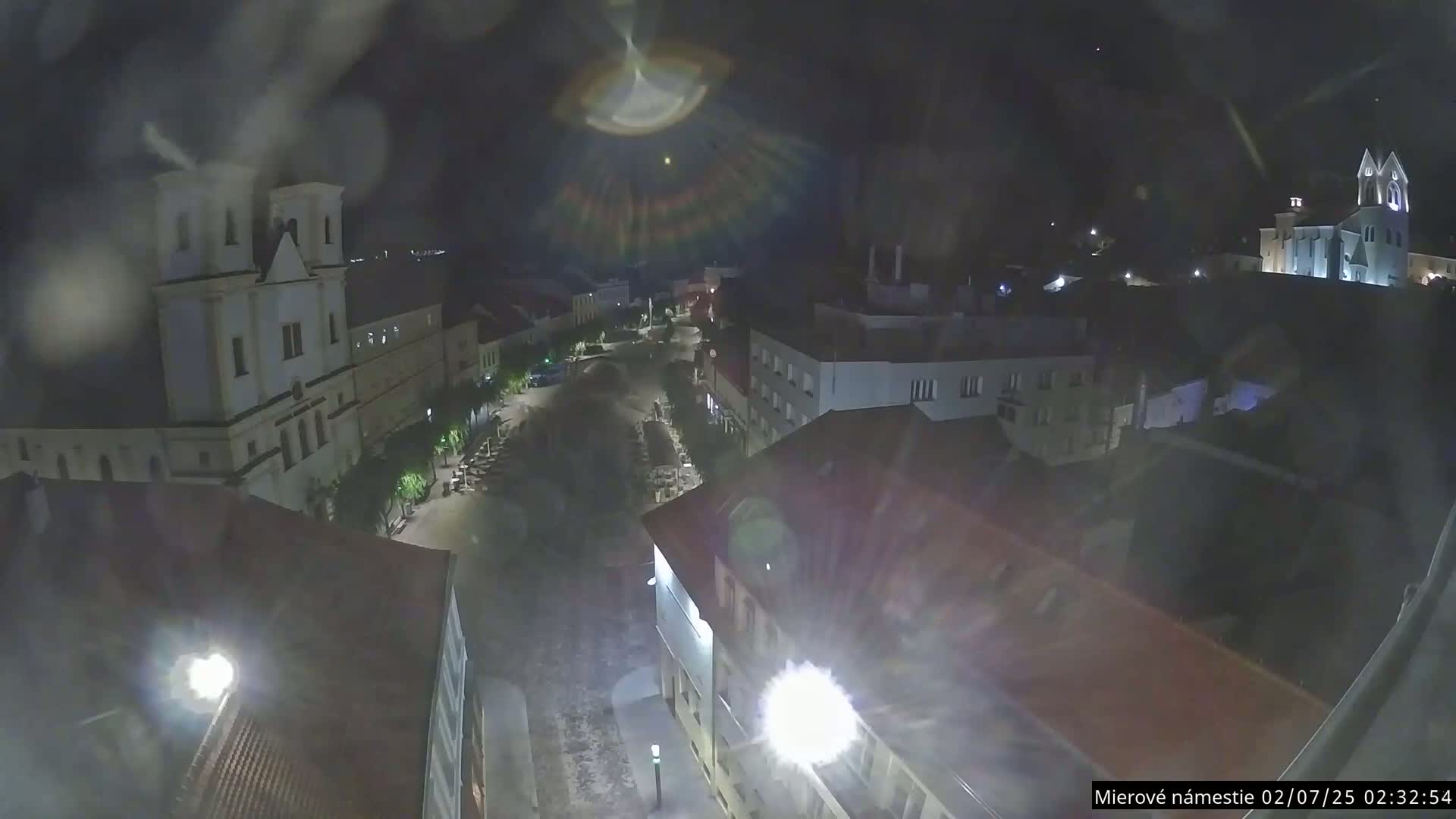 Trenčín, Piaristický kostol sv. Františka Xaverského Church & Trenciansky Hrad (Ttencin Castle) at Mierové námestie Square East View Live Cam - Trencin, Okres Trencin, Slovakia 