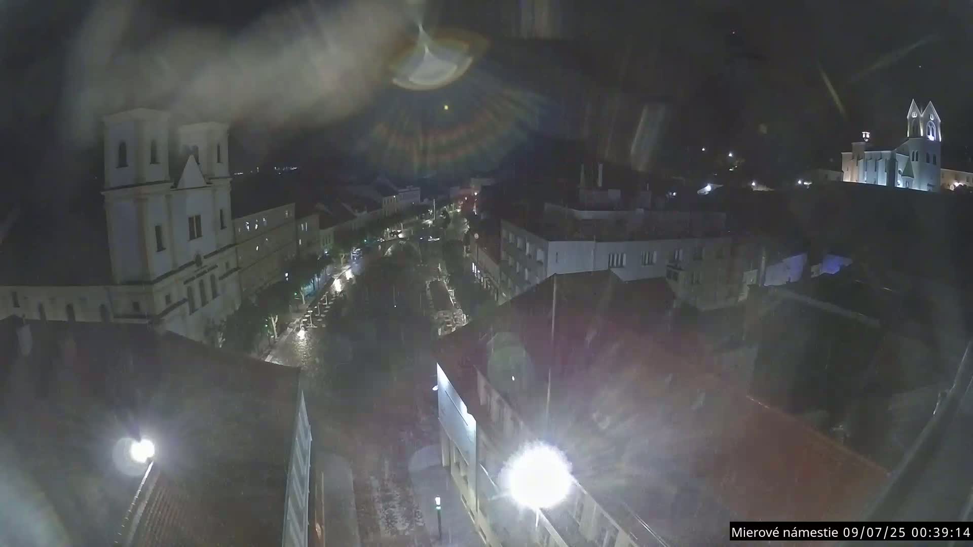 Trenčín, Piaristický kostol sv. Františka Xaverského Church & Trenciansky Hrad (Ttencin Castle) at Mierové námestie Square East View Live Cam - Trencin, Okres Trencin, Slovakia 