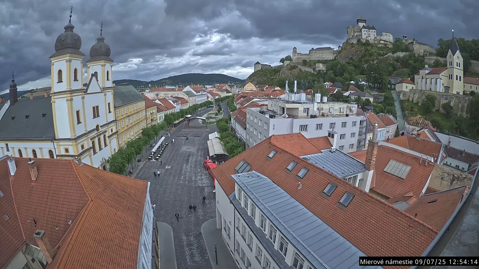 Trenčín, Piaristický kostol sv. Františka Xaverského Church & Trenciansky Hrad (Ttencin Castle) at Mierové námestie Square East View Live Cam - Trencin, Okres Trencin, Slovakia 