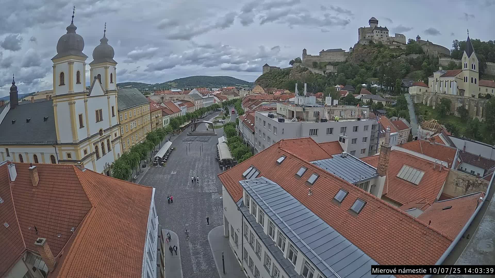 Trenčín, Piaristický kostol sv. Františka Xaverského Church & Trenciansky Hrad (Ttencin Castle) at Mierové námestie Square East View Live Cam - Trencin, Okres Trencin, Slovakia 