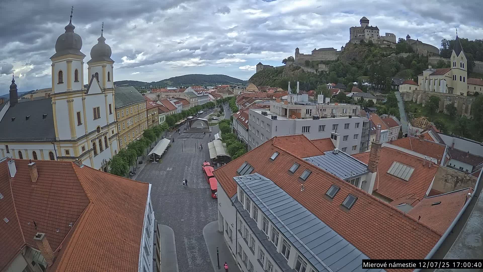 Trenčín, Piaristický kostol sv. Františka Xaverského Church & Trenciansky Hrad (Ttencin Castle) at Mierové námestie Square East View Live Cam - Trencin, Okres Trencin, Slovakia 
