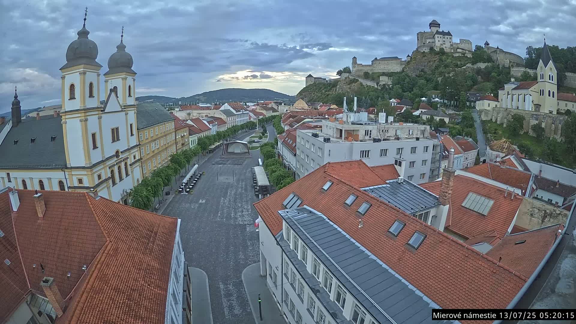 Trenčín, Piaristický kostol sv. Františka Xaverského Church & Trenciansky Hrad (Ttencin Castle) at Mierové námestie Square East View Live Cam - Trencin, Okres Trencin, Slovakia 