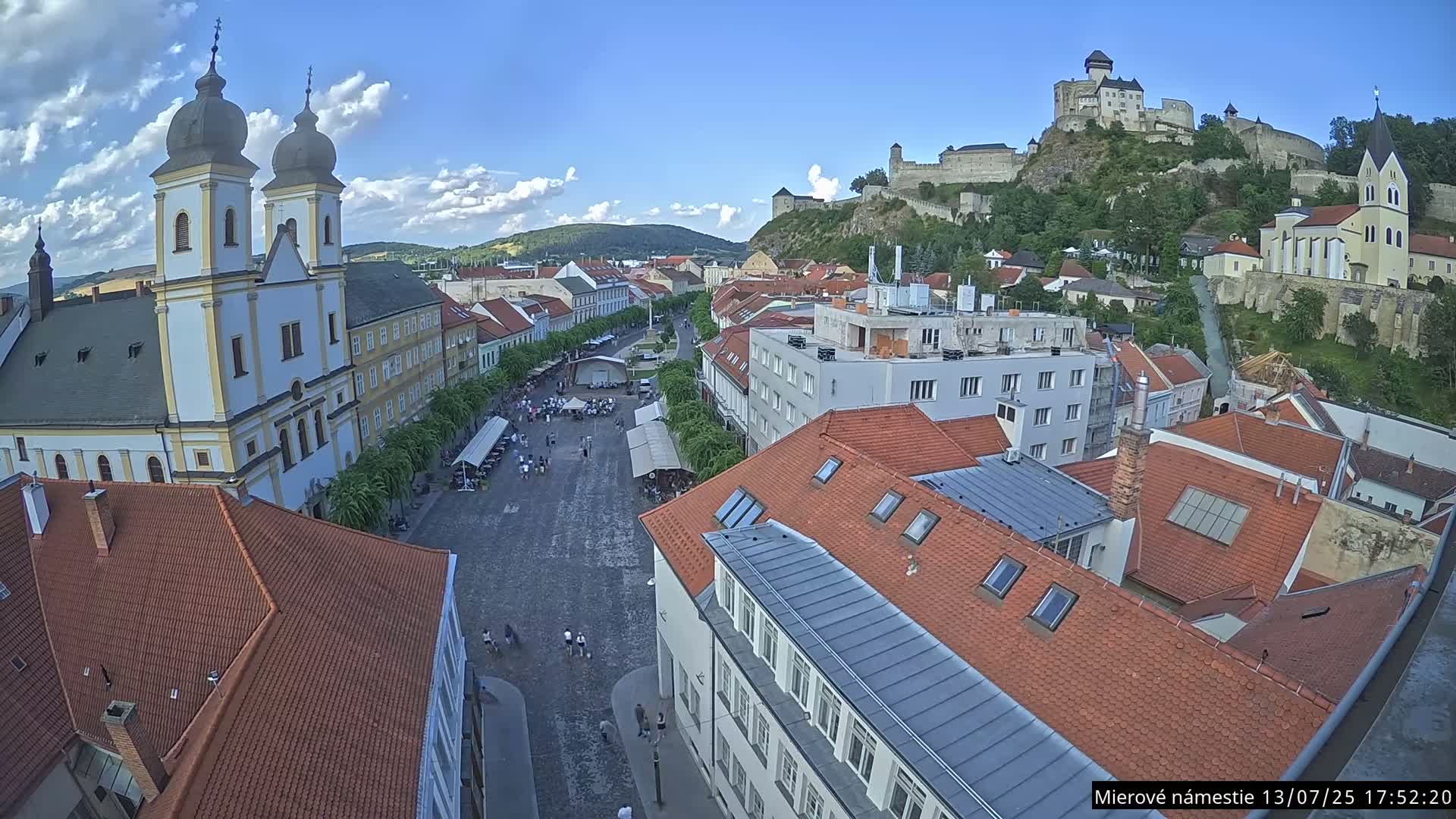 Trenčín, Piaristický kostol sv. Františka Xaverského Church & Trenciansky Hrad (Ttencin Castle) at Mierové námestie Square East View Live Cam - Trencin, Okres Trencin, Slovakia 