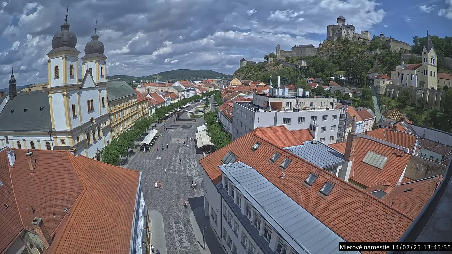 Trenčín, Piaristický kostol sv. Františka Xaverského Church & Trenciansky Hrad (Ttencin Castle) at Mierové námestie Square East View Live Cam - Trencin, Okres Trencin, Slovakia 