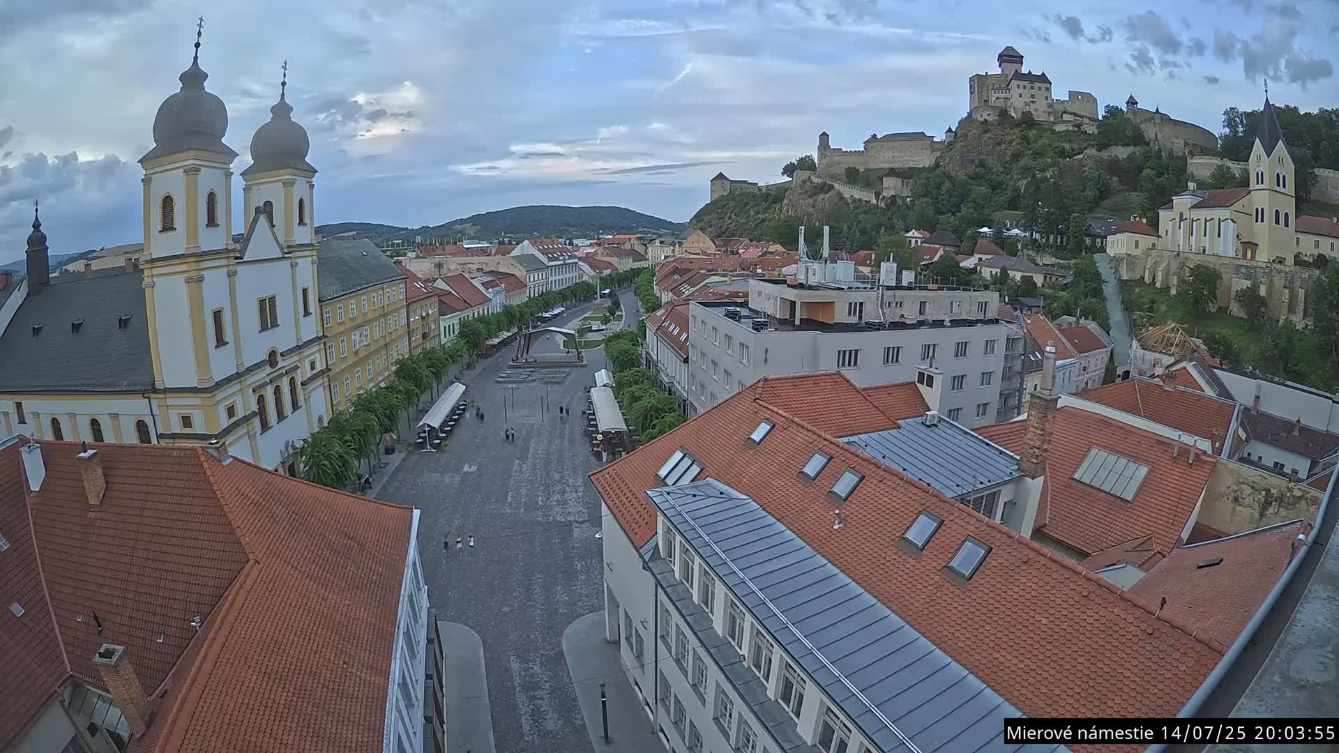 Trenčín, Piaristický kostol sv. Františka Xaverského Church & Trenciansky Hrad (Ttencin Castle) at Mierové námestie Square East View Live Cam - Trencin, Okres Trencin, Slovakia 