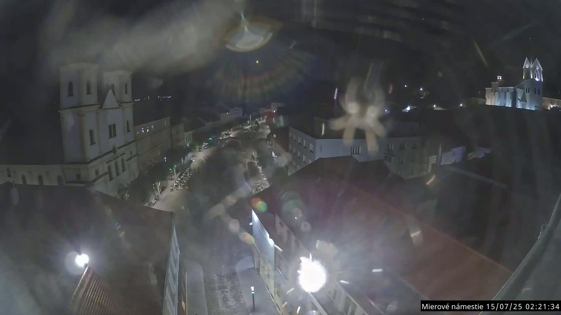 Trenčín, Piaristický kostol sv. Františka Xaverského Church & Trenciansky Hrad (Ttencin Castle) at Mierové námestie Square East View Live Cam - Trencin, Okres Trencin, Slovakia 