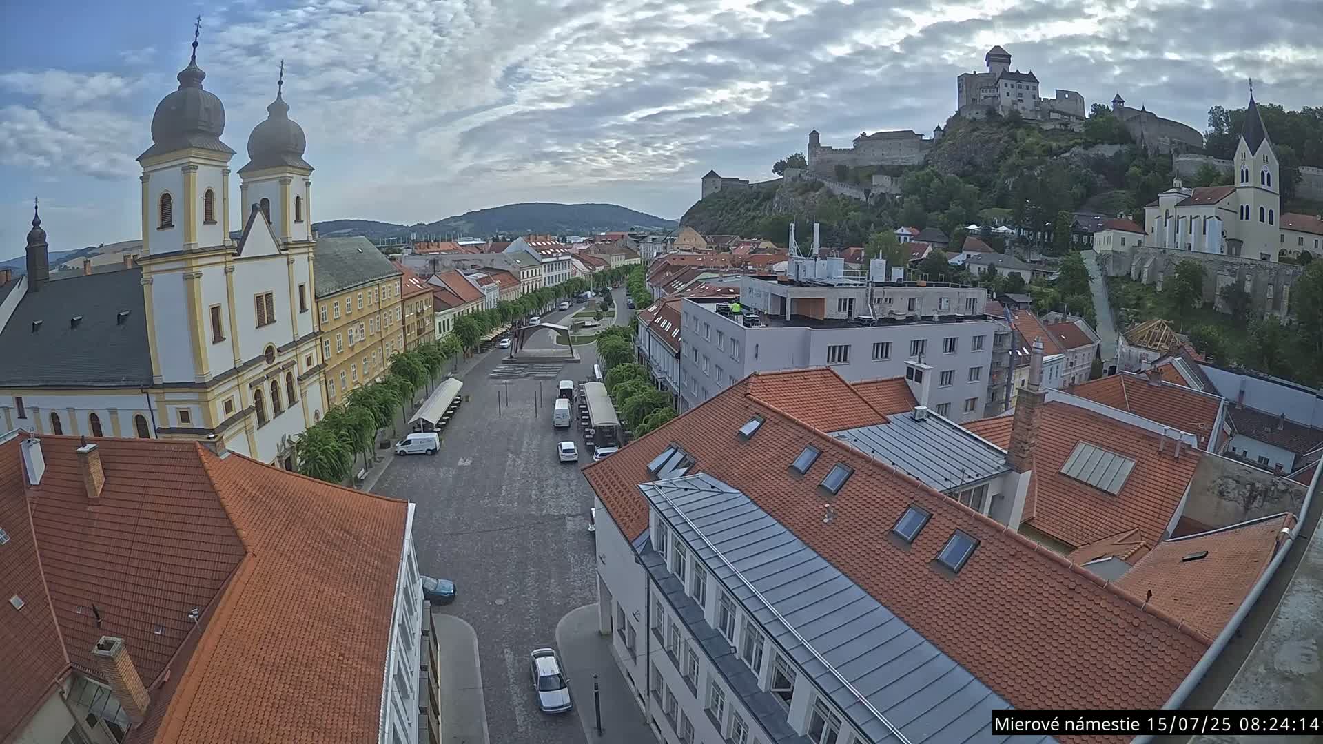 Trenčín, Piaristický kostol sv. Františka Xaverského Church & Trenciansky Hrad (Ttencin Castle) at Mierové námestie Square East View Live Cam - Trencin, Okres Trencin, Slovakia 