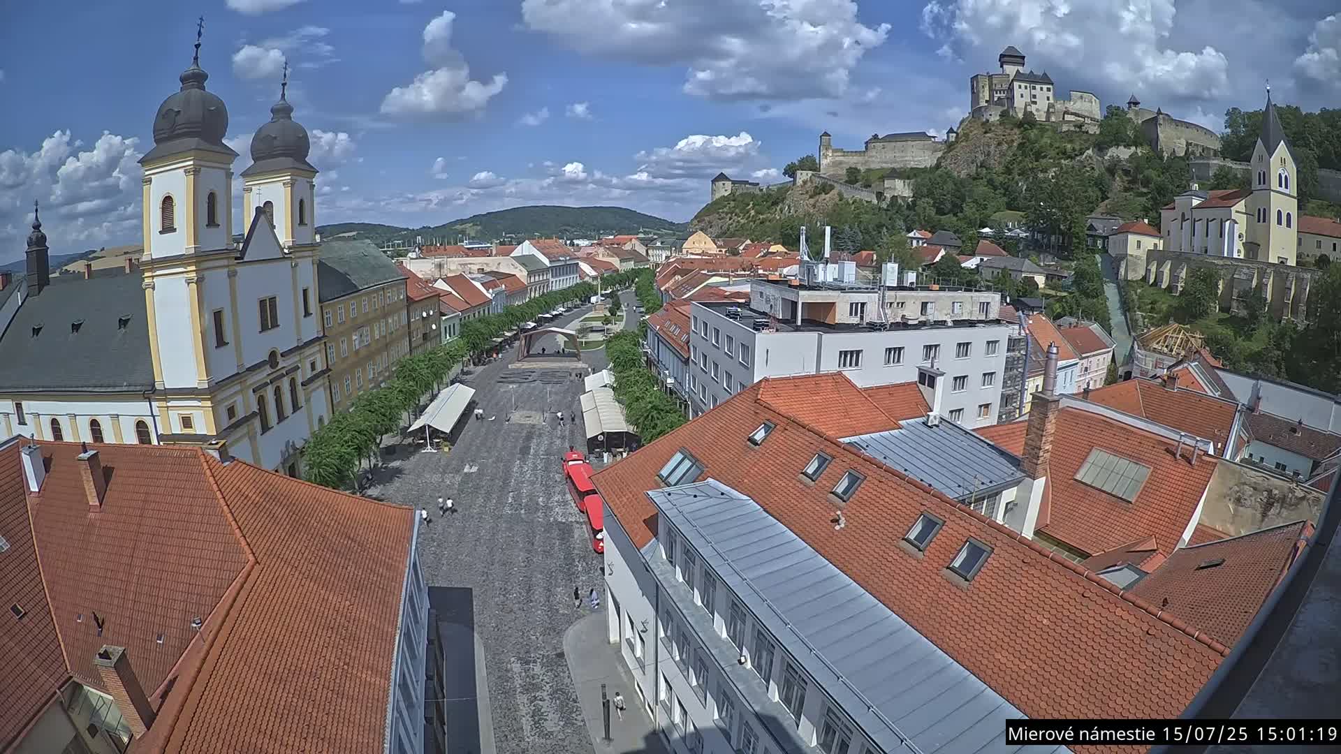 Trenčín, Piaristický kostol sv. Františka Xaverského Church & Trenciansky Hrad (Ttencin Castle) at Mierové námestie Square East View Live Cam - Trencin, Okres Trencin, Slovakia 
