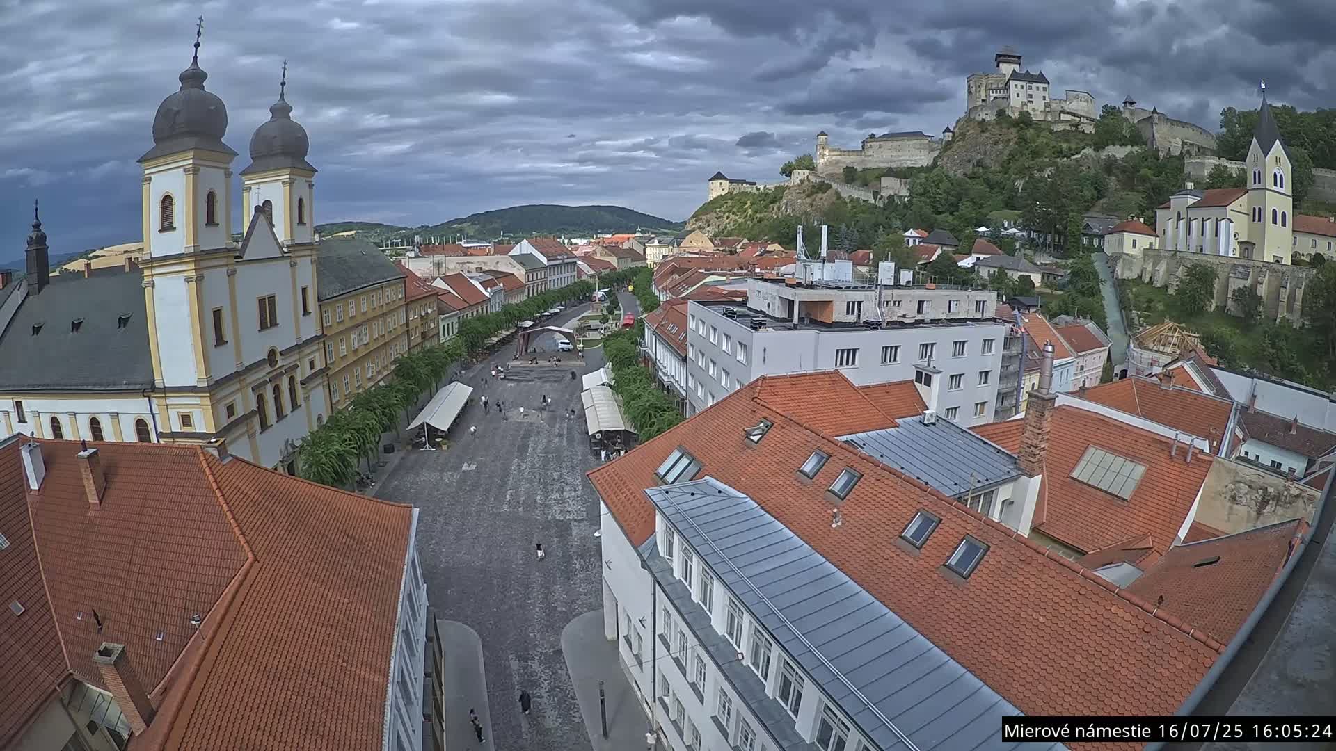 Trenčín, Piaristický kostol sv. Františka Xaverského Church & Trenciansky Hrad (Ttencin Castle) at Mierové námestie Square East View Live Cam - Trencin, Okres Trencin, Slovakia 