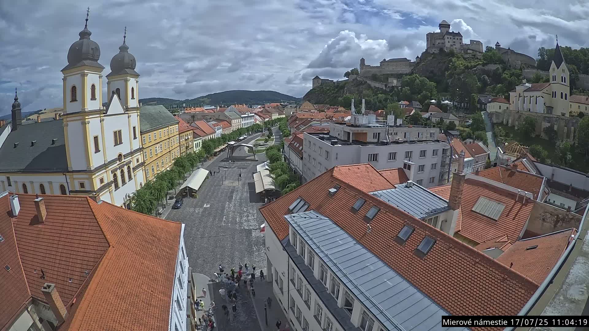Trenčín, Piaristický kostol sv. Františka Xaverského Church & Trenciansky Hrad (Ttencin Castle) at Mierové námestie Square East View Live Cam - Trencin, Okres Trencin, Slovakia 