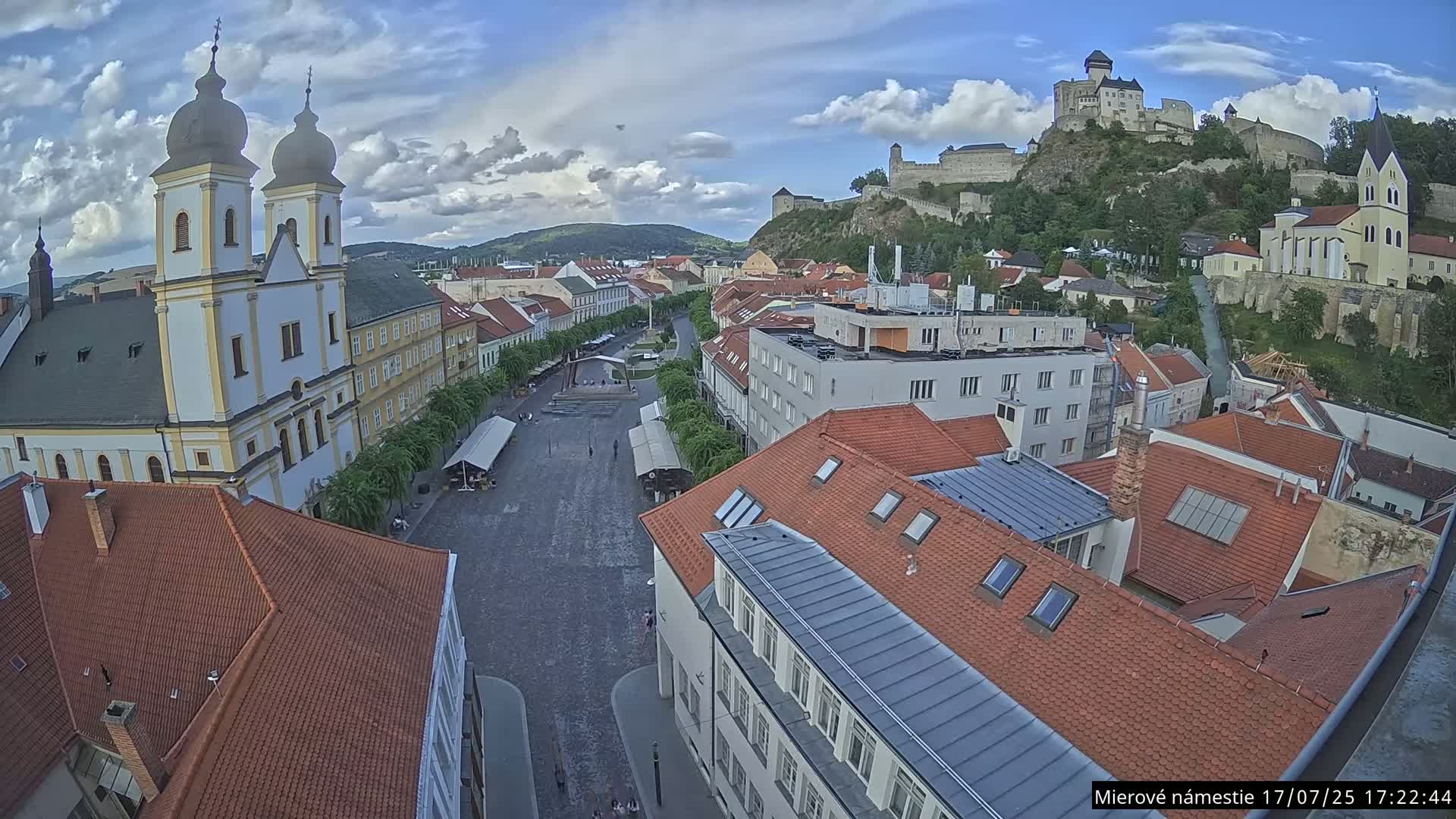 Trenčín, Piaristický kostol sv. Františka Xaverského Church & Trenciansky Hrad (Ttencin Castle) at Mierové námestie Square East View Live Cam - Trencin, Okres Trencin, Slovakia 