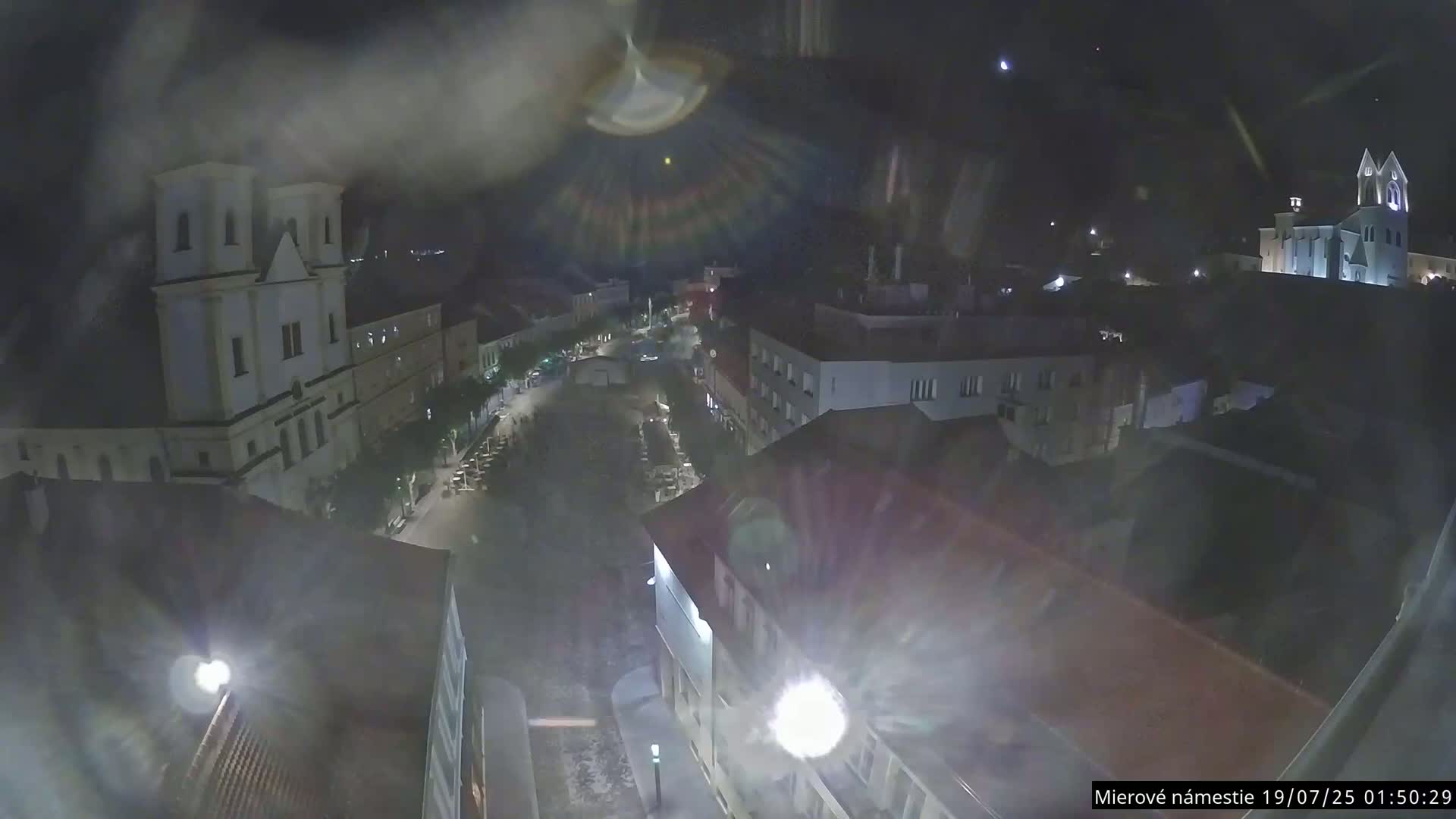 Trenčín, Piaristický kostol sv. Františka Xaverského Church & Trenciansky Hrad (Ttencin Castle) at Mierové námestie Square East View Live Cam - Trencin, Okres Trencin, Slovakia 