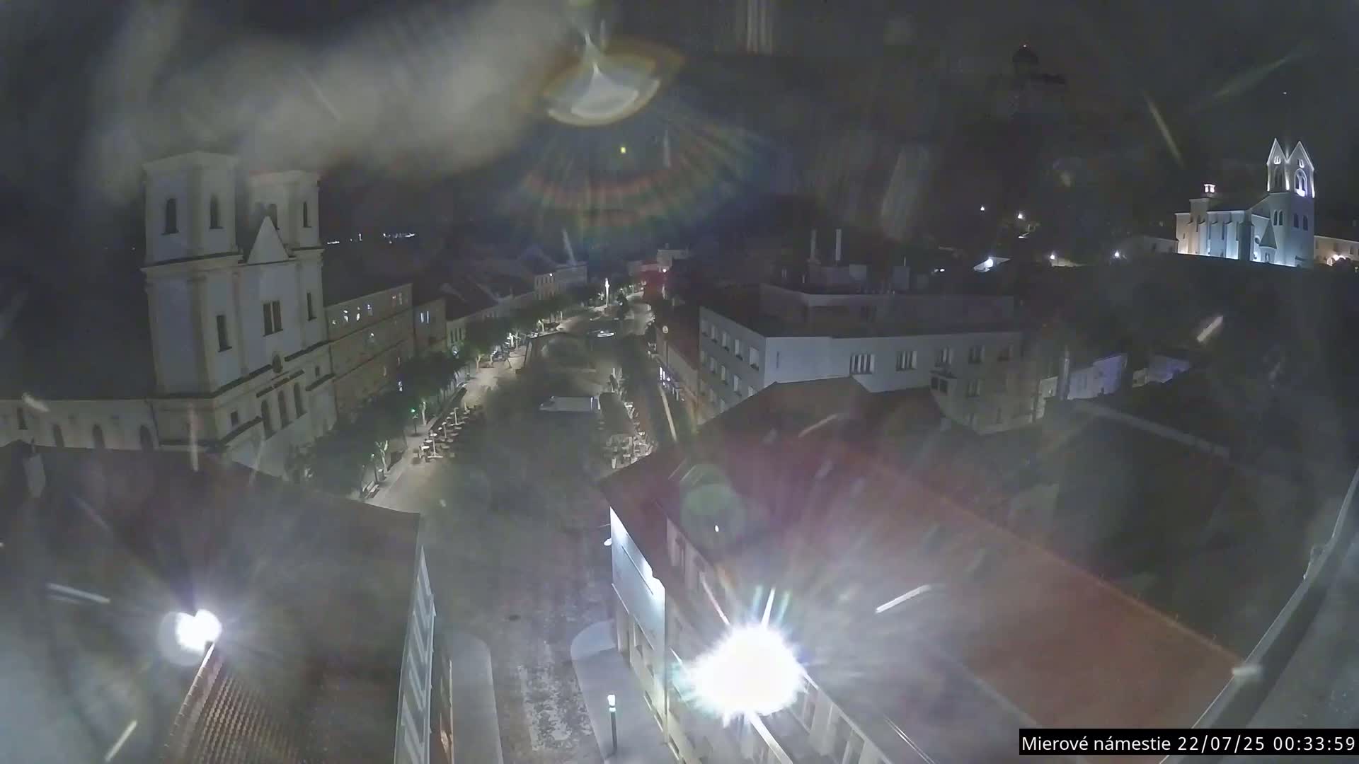 Trenčín, Piaristický kostol sv. Františka Xaverského Church & Trenciansky Hrad (Ttencin Castle) at Mierové námestie Square East View Live Cam - Trencin, Okres Trencin, Slovakia 