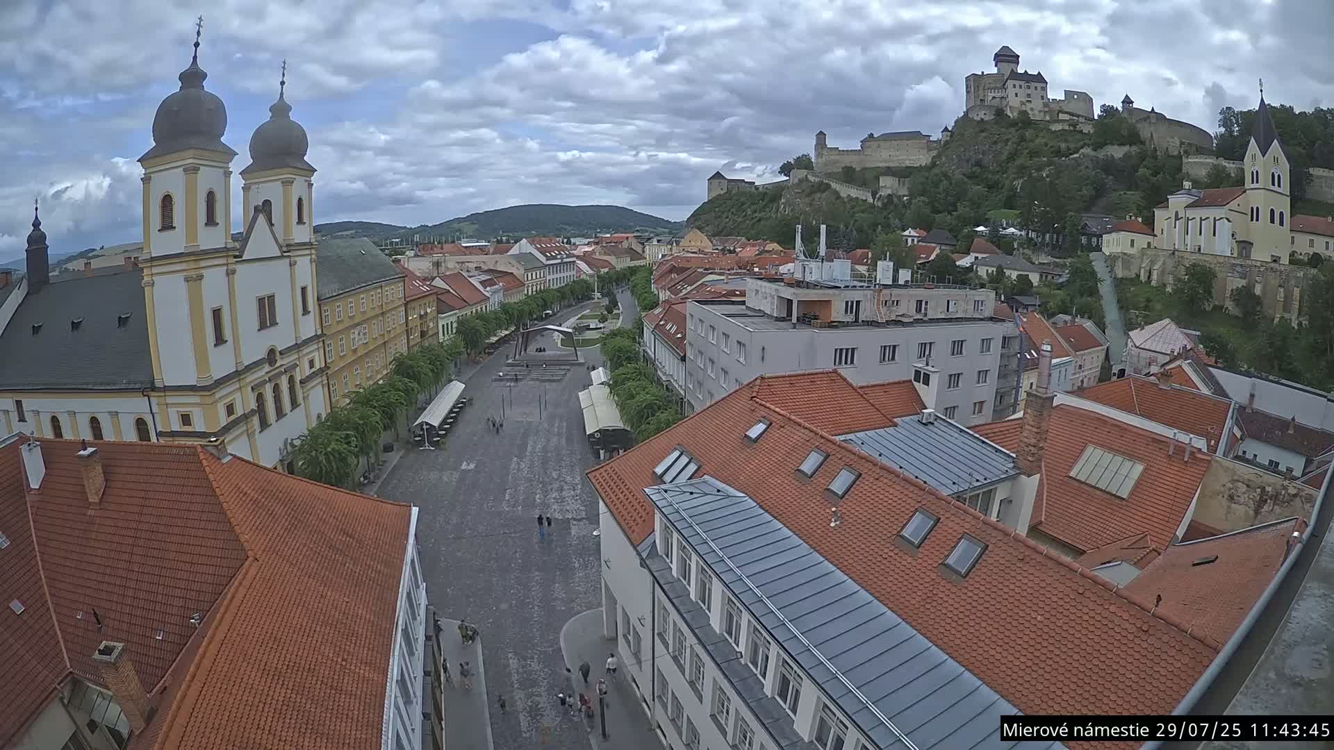 Trenčín, Piaristický kostol sv. Františka Xaverského Church & Trenciansky Hrad (Ttencin Castle) at Mierové námestie Square East View Live Cam - Trencin, Okres Trencin, Slovakia 