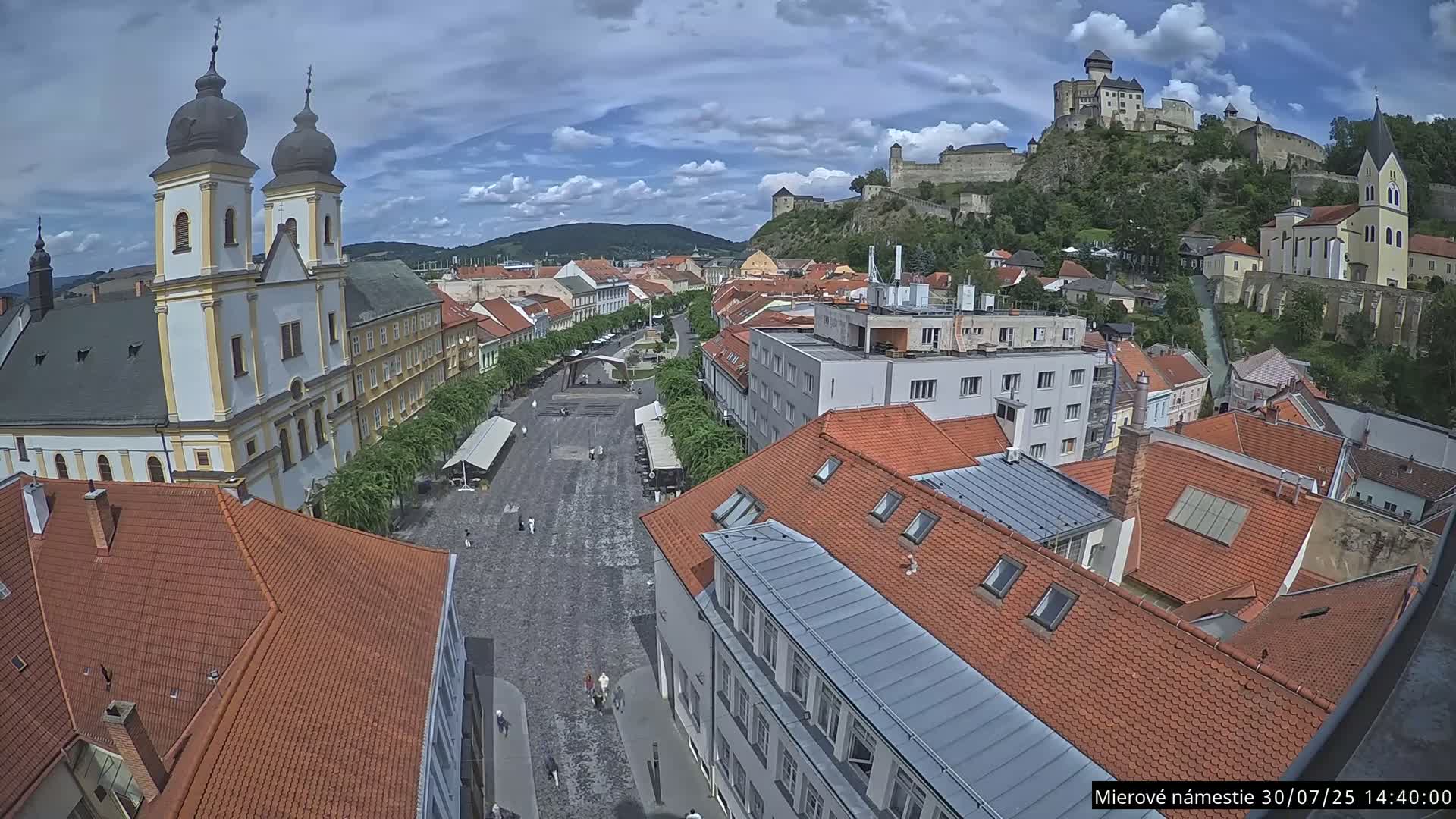 Trenčín, Piaristický kostol sv. Františka Xaverského Church & Trenciansky Hrad (Ttencin Castle) at Mierové námestie Square East View Live Cam - Trencin, Okres Trencin, Slovakia 