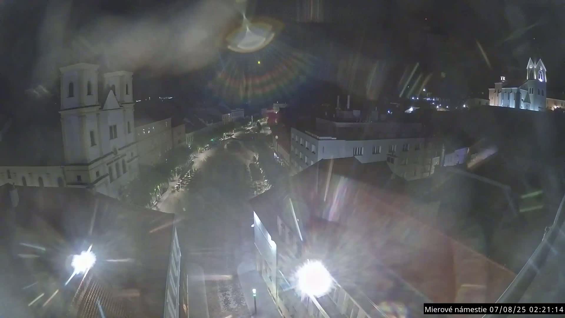 Trenčín, Piaristický kostol sv. Františka Xaverského Church & Trenciansky Hrad (Ttencin Castle) at Mierové námestie Square East View Live Cam - Trencin, Okres Trencin, Slovakia