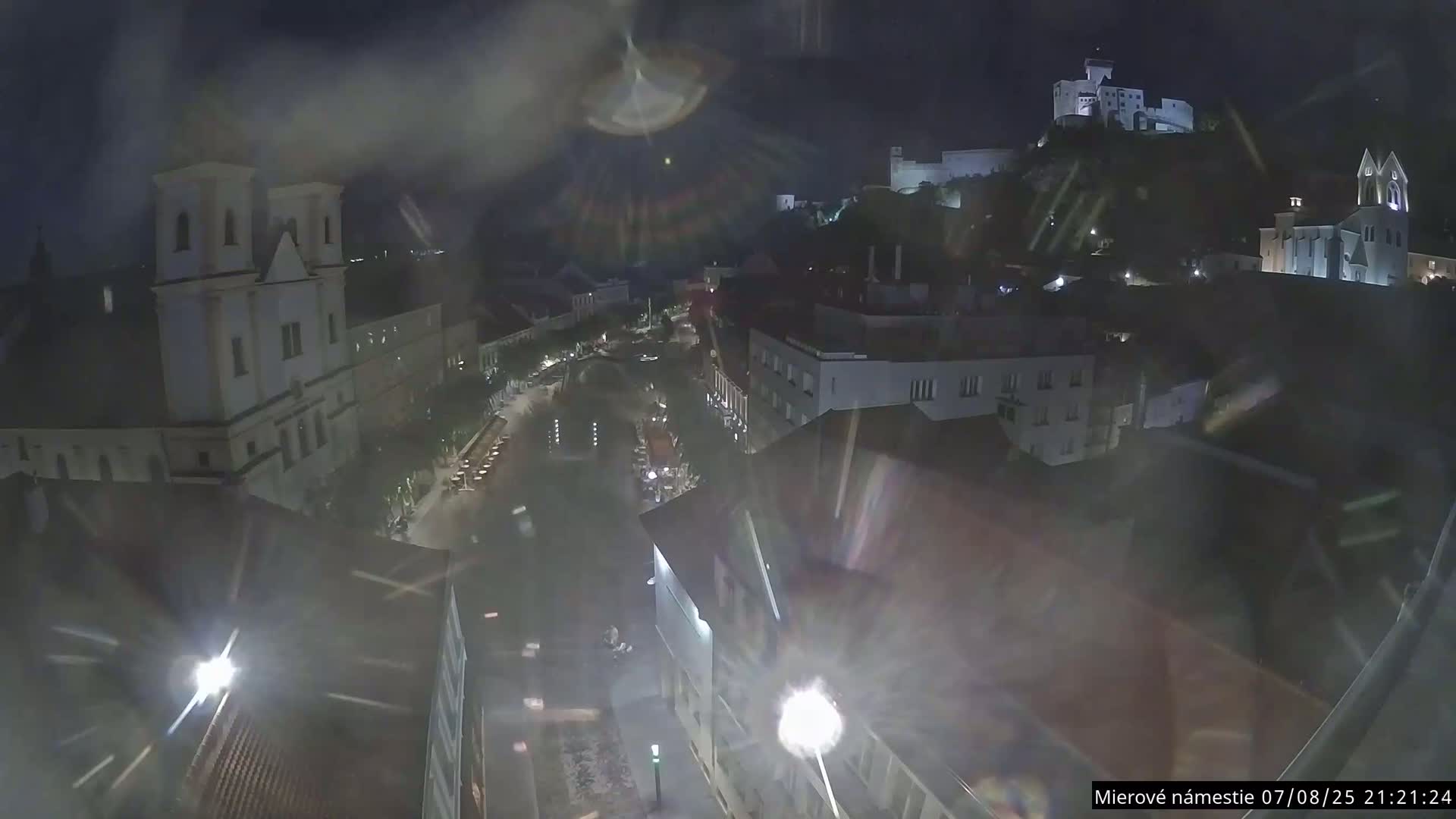 Trenčín, Piaristický kostol sv. Františka Xaverského Church & Trenciansky Hrad (Ttencin Castle) at Mierové námestie Square East View Live Cam - Trencin, Okres Trencin, Slovakia 