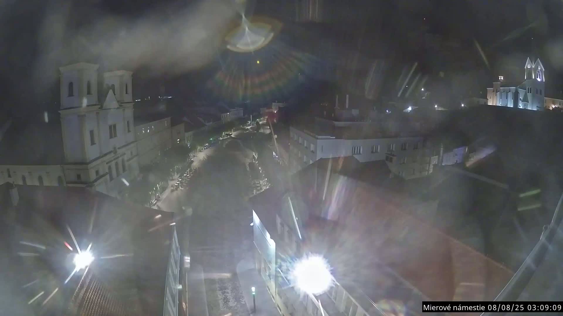Trenčín, Piaristický kostol sv. Františka Xaverského Church & Trenciansky Hrad (Ttencin Castle) at Mierové námestie Square East View Live Cam - Trencin, Okres Trencin, Slovakia 
