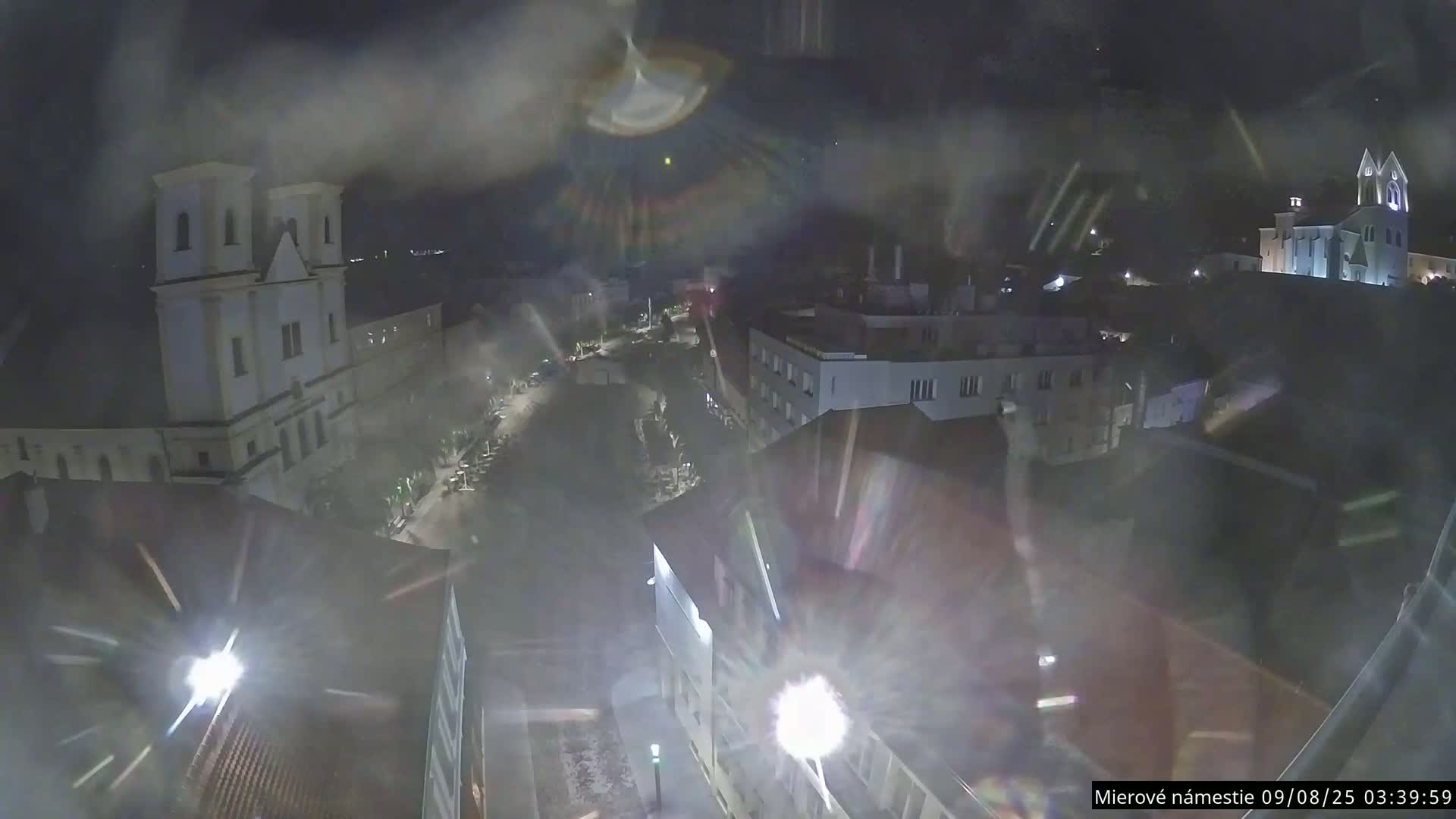 Trenčín, Piaristický kostol sv. Františka Xaverského Church & Trenciansky Hrad (Ttencin Castle) at Mierové námestie Square East View Live Cam - Trencin, Okres Trencin, Slovakia 
