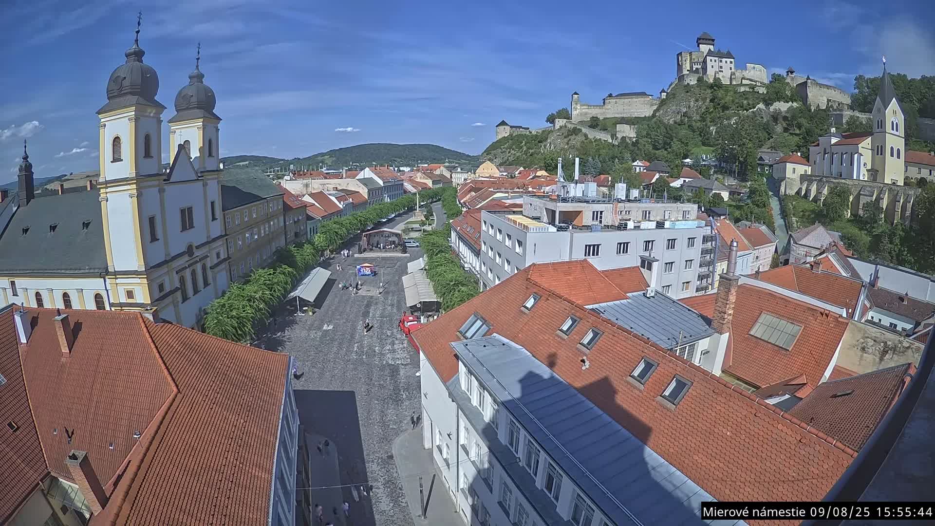 Trenčín, Piaristický kostol sv. Františka Xaverského Church & Trenciansky Hrad (Ttencin Castle) at Mierové námestie Square East View Live Cam - Trencin, Okres Trencin, Slovakia 