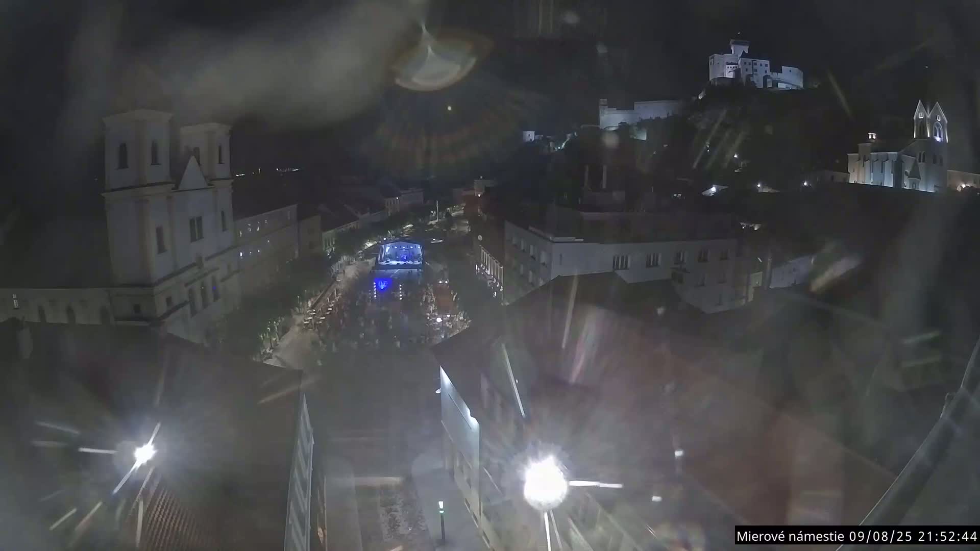 Trenčín, Piaristický kostol sv. Františka Xaverského Church & Trenciansky Hrad (Ttencin Castle) at Mierové námestie Square East View Live Cam - Trencin, Okres Trencin, Slovakia 
