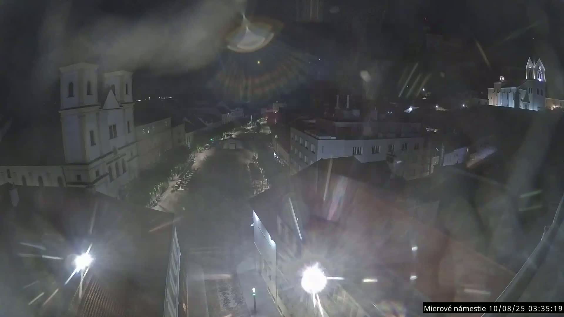 Trenčín, Piaristický kostol sv. Františka Xaverského Church & Trenciansky Hrad (Ttencin Castle) at Mierové námestie Square East View Live Cam - Trencin, Okres Trencin, Slovakia 