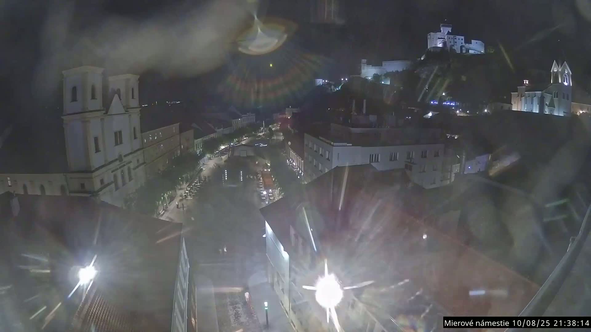 Trenčín, Piaristický kostol sv. Františka Xaverského Church & Trenciansky Hrad (Ttencin Castle) at Mierové námestie Square East View Live Cam - Trencin, Okres Trencin, Slovakia 