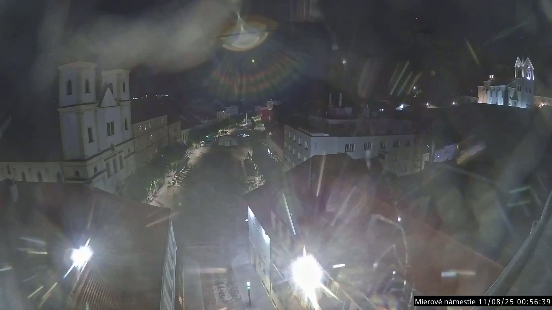 Trenčín, Piaristický kostol sv. Františka Xaverského Church & Trenciansky Hrad (Ttencin Castle) at Mierové námestie Square East View Live Cam - Trencin, Okres Trencin, Slovakia 