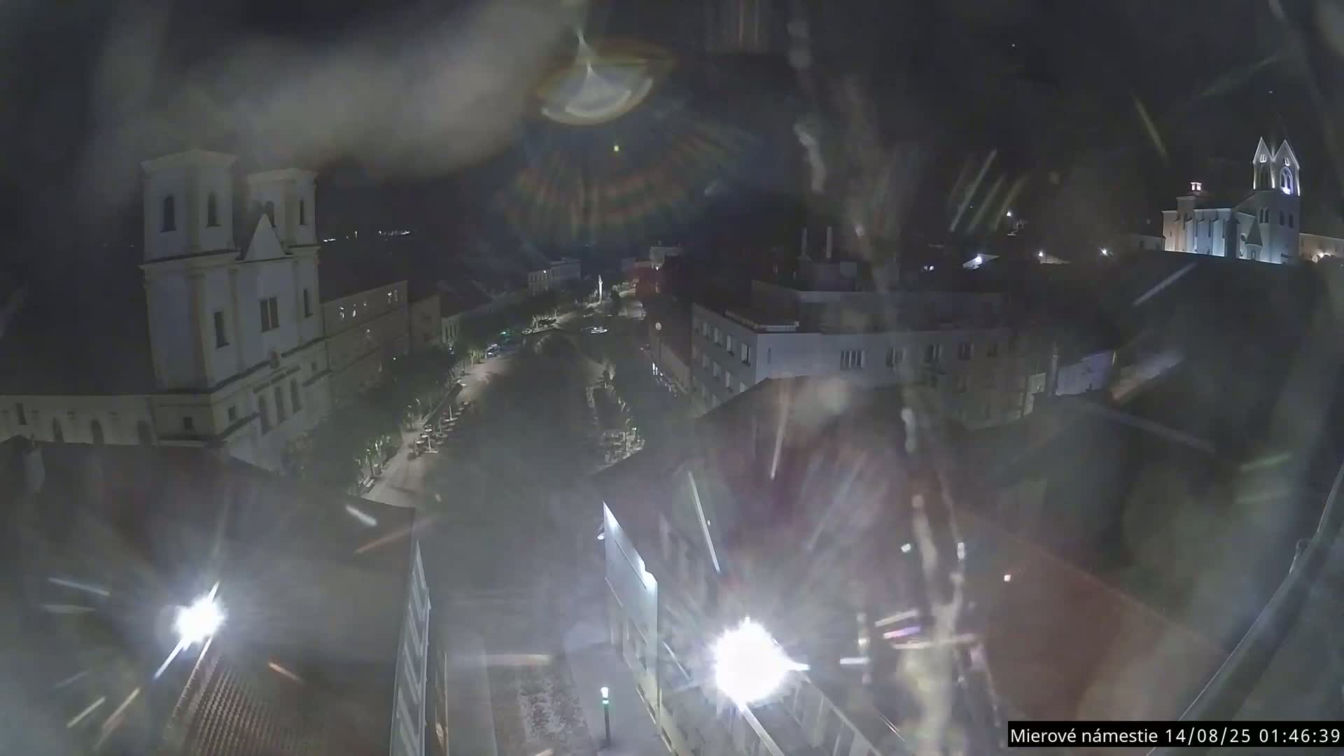 Trenčín, Piaristický kostol sv. Františka Xaverského Church & Trenciansky Hrad (Ttencin Castle) at Mierové námestie Square East View Live Cam - Trencin, Okres Trencin, Slovakia 