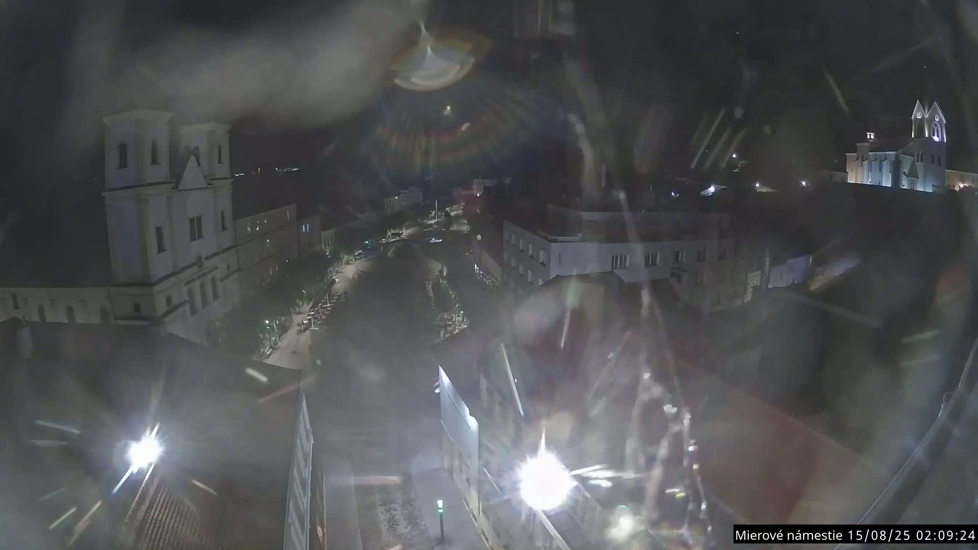 Trenčín, Piaristický kostol sv. Františka Xaverského Church & Trenciansky Hrad (Ttencin Castle) at Mierové námestie Square East View Live Cam - Trencin, Okres Trencin, Slovakia 