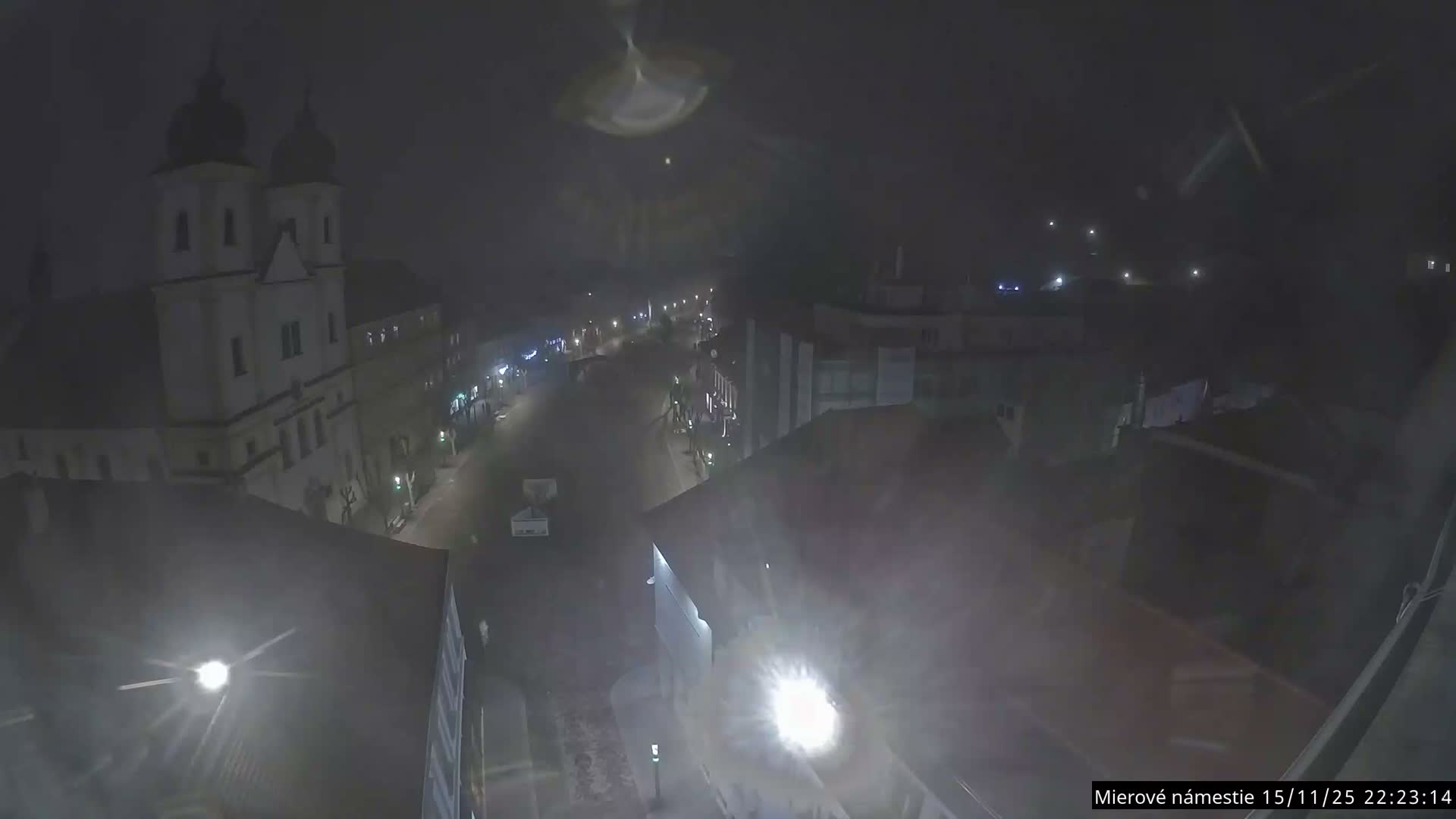 Trenčín, Piaristický kostol sv. Františka Xaverského Church & Trenciansky Hrad (Ttencin Castle) at Mierové námestie Square East View Live Cam - Trencin, Okres Trencin, Slovakia 