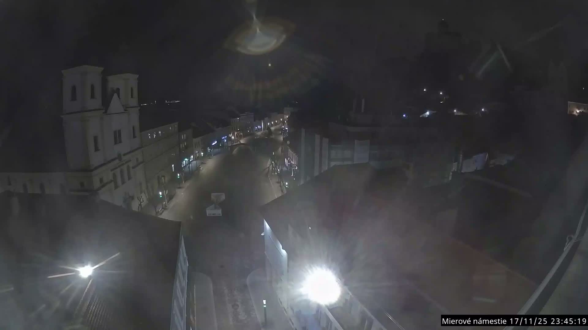 Trenčín, Piaristický kostol sv. Františka Xaverského Church & Trenciansky Hrad (Ttencin Castle) at Mierové námestie Square East View Live Cam - Trencin, Okres Trencin, Slovakia 