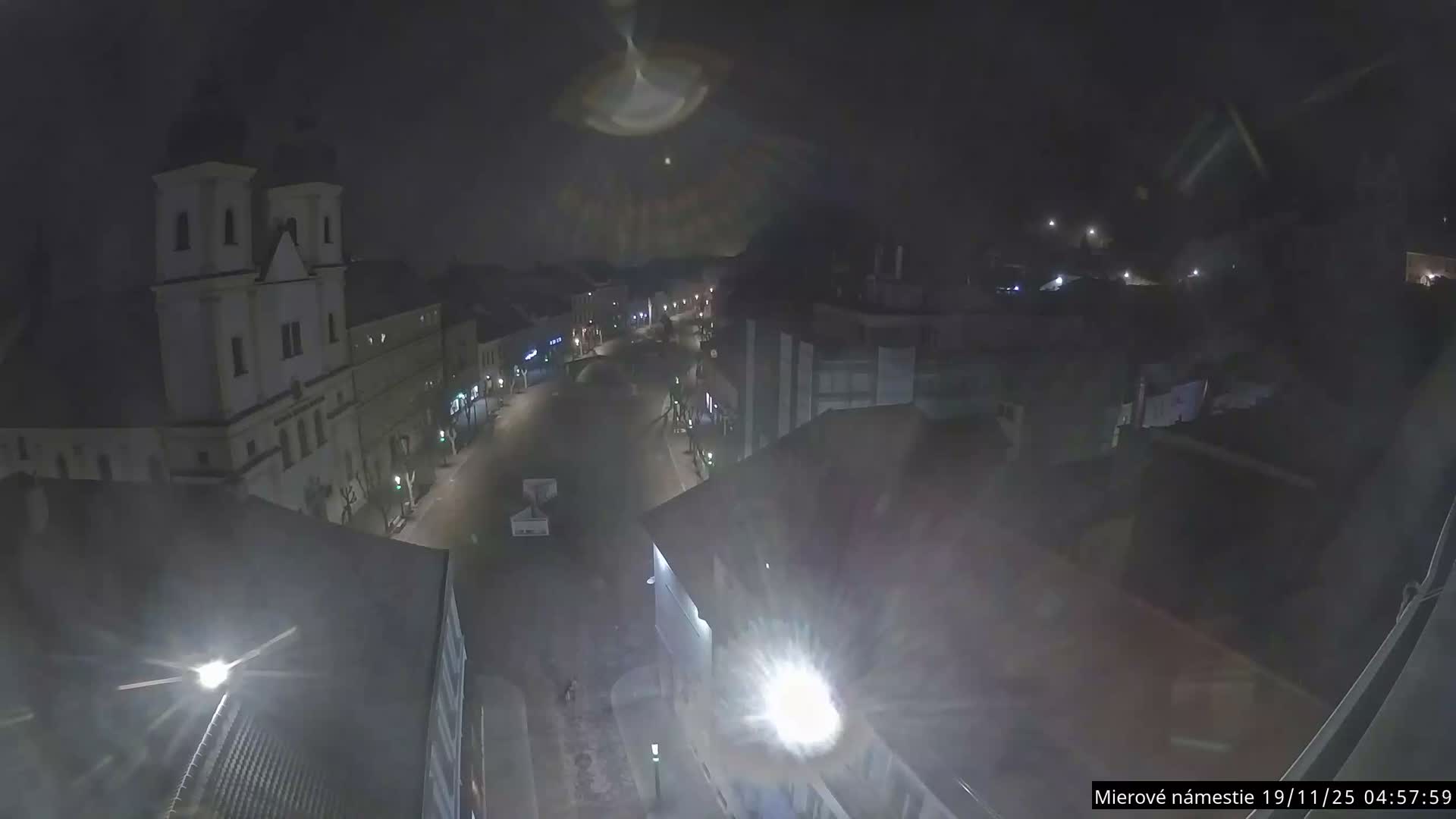 Trenčín, Piaristický kostol sv. Františka Xaverského Church & Trenciansky Hrad (Ttencin Castle) at Mierové námestie Square East View Live Cam - Trencin, Okres Trencin, Slovakia 