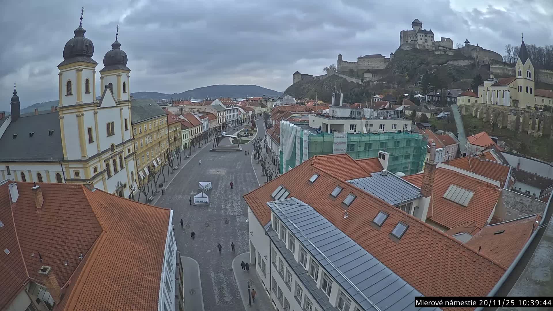 Trenčín, Piaristický kostol sv. Františka Xaverského Church & Trenciansky Hrad (Ttencin Castle) at Mierové námestie Square East View Live Cam - Trencin, Okres Trencin, Slovakia 