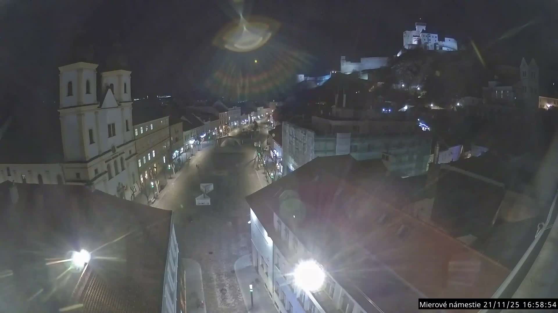 Trenčín, Piaristický kostol sv. Františka Xaverského Church & Trenciansky Hrad (Ttencin Castle) at Mierové námestie Square East View Live Cam - Trencin, Okres Trencin, Slovakia 