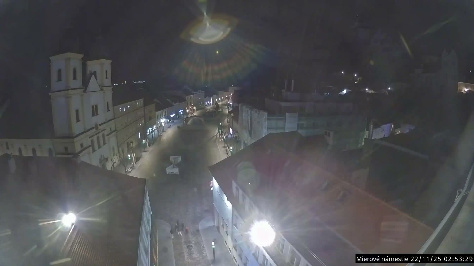 Trenčín, Piaristický kostol sv. Františka Xaverského Church & Trenciansky Hrad (Ttencin Castle) at Mierové námestie Square East View Live Cam - Trencin, Okres Trencin, Slovakia 