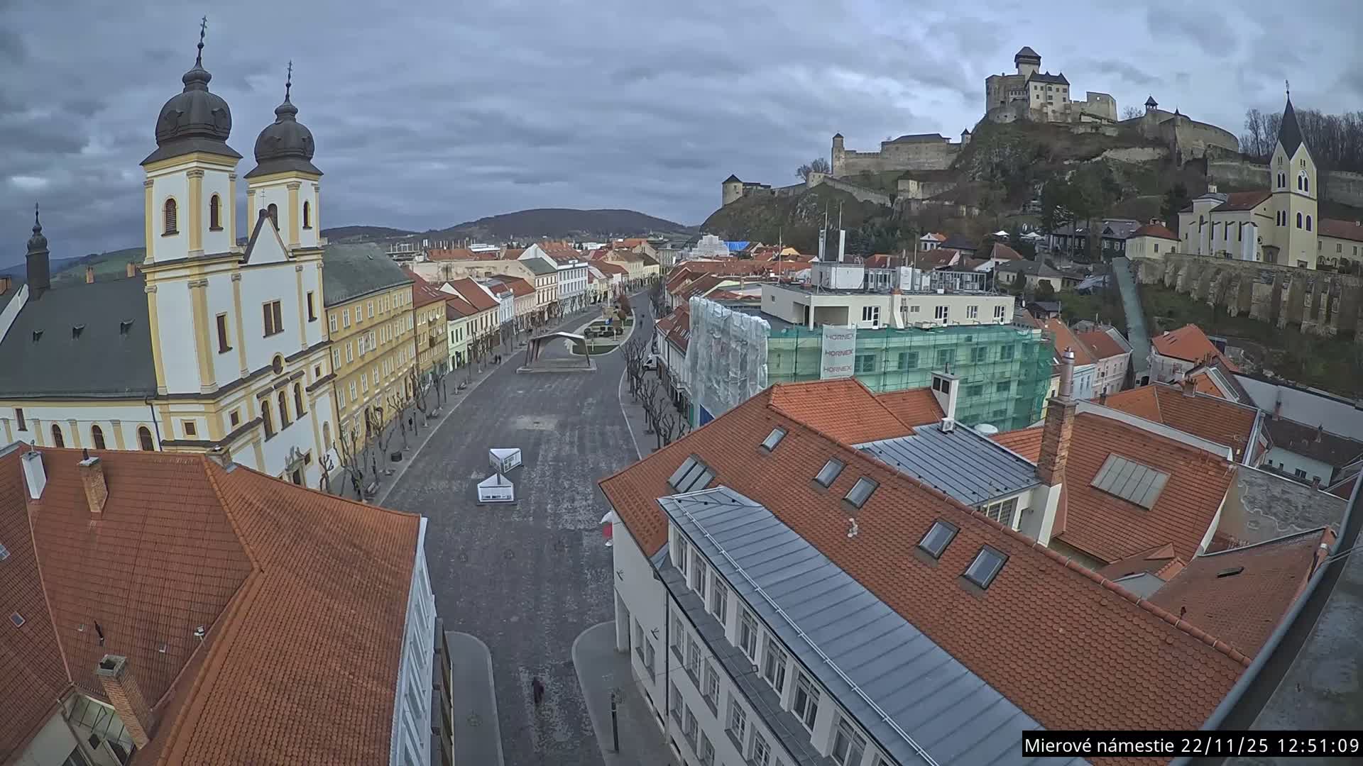 Trenčín, Piaristický kostol sv. Františka Xaverského Church & Trenciansky Hrad (Ttencin Castle) at Mierové námestie Square East View Live Cam - Trencin, Okres Trencin, Slovakia 