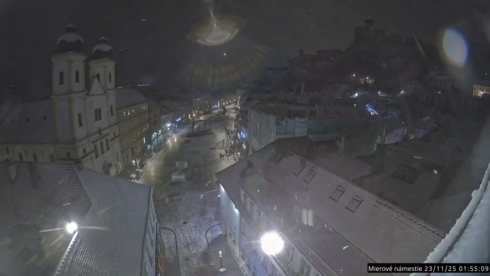 Trenčín, Piaristický kostol sv. Františka Xaverského Church & Trenciansky Hrad (Ttencin Castle) at Mierové námestie Square East View Live Cam - Trencin, Okres Trencin, Slovakia 