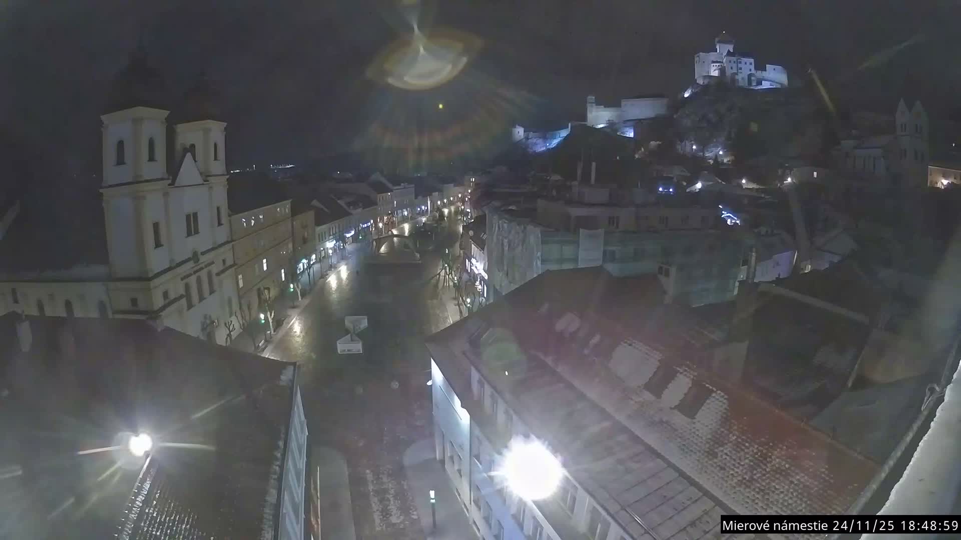 Trenčín, Piaristický kostol sv. Františka Xaverského Church & Trenciansky Hrad (Ttencin Castle) at Mierové námestie Square East View Live Cam - Trencin, Okres Trencin, Slovakia 
