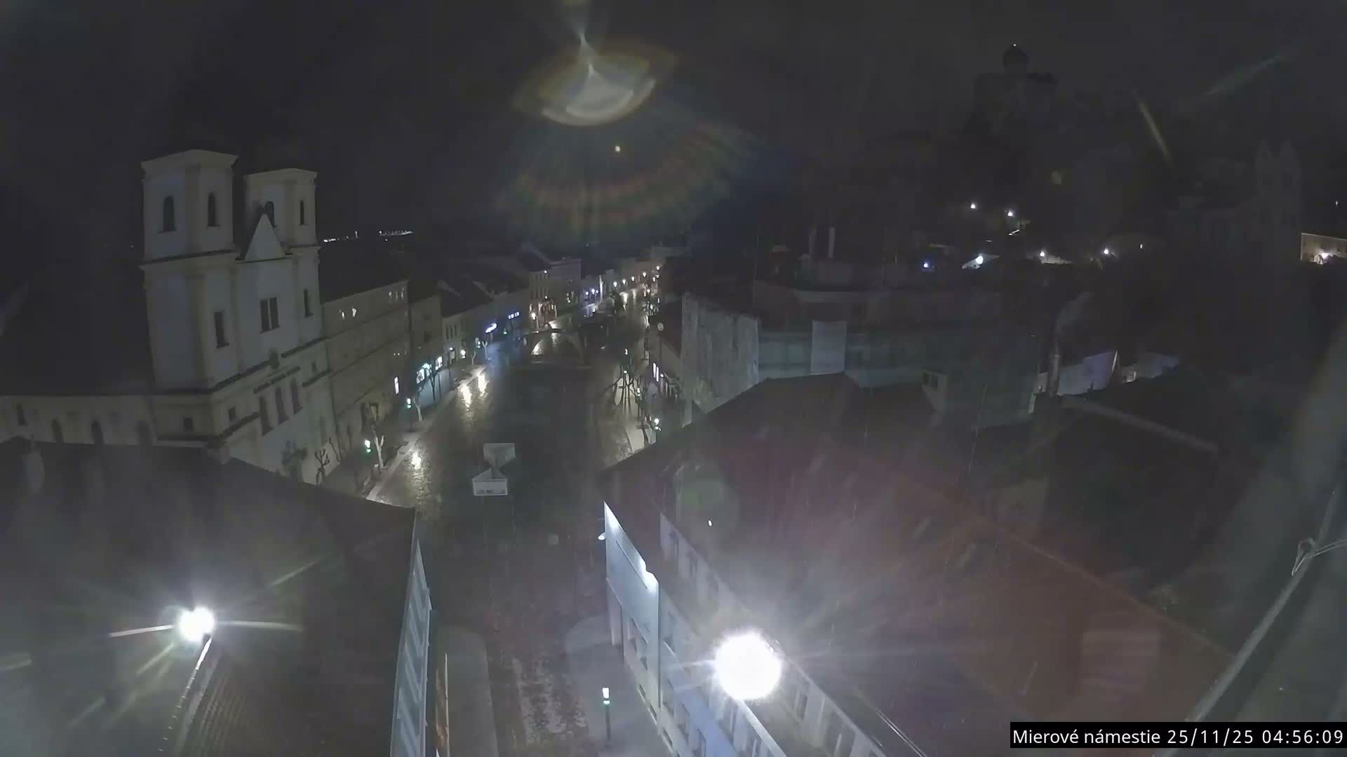 Trenčín, Piaristický kostol sv. Františka Xaverského Church & Trenciansky Hrad (Ttencin Castle) at Mierové námestie Square East View Live Cam - Trencin, Okres Trencin, Slovakia 