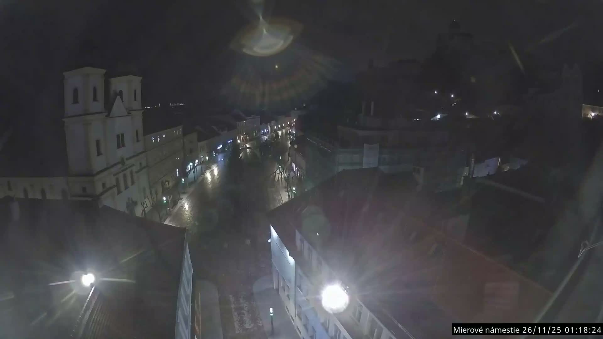 Trenčín, Piaristický kostol sv. Františka Xaverského Church & Trenciansky Hrad (Ttencin Castle) at Mierové námestie Square East View Live Cam - Trencin, Okres Trencin, Slovakia 